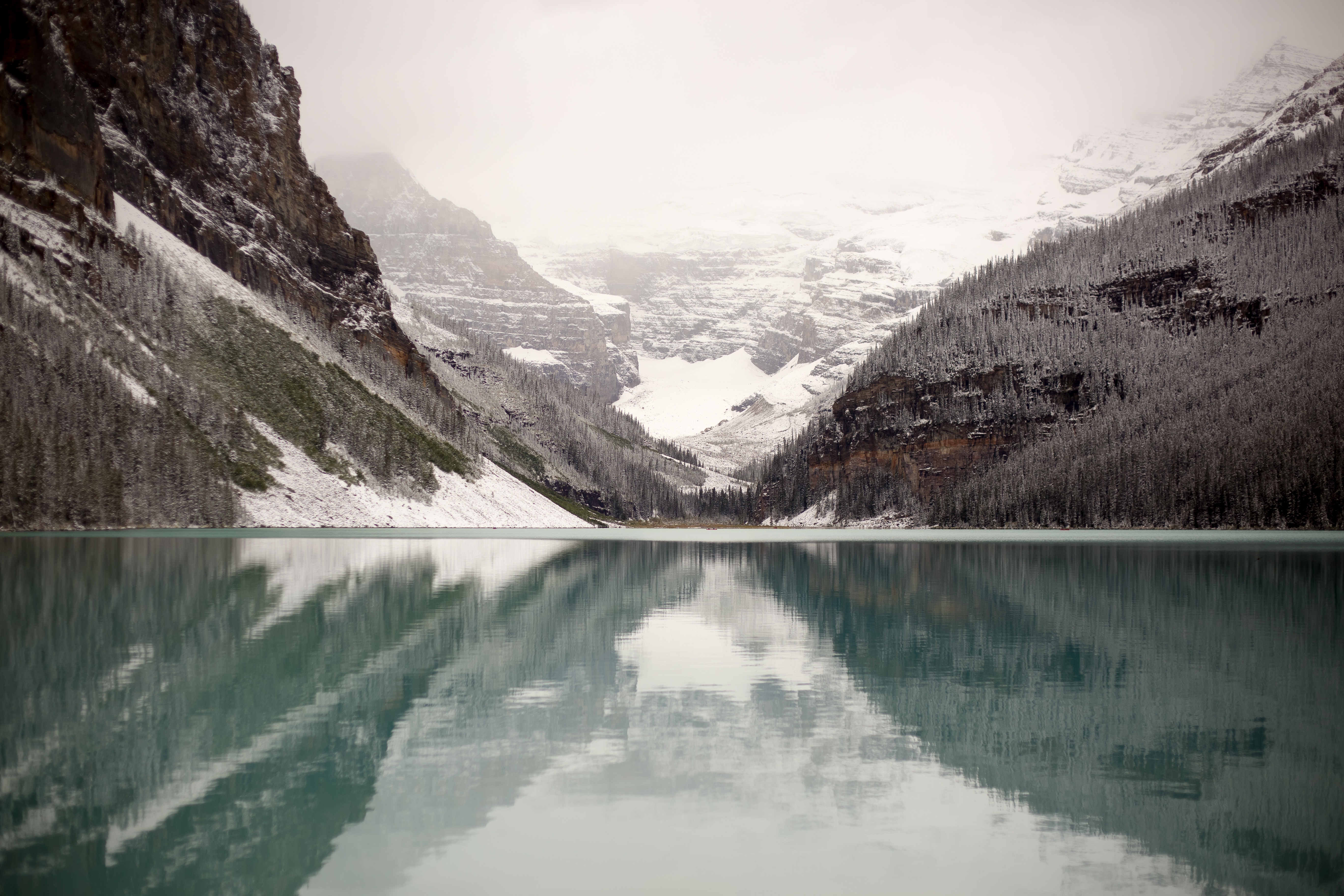 Lake Louise in Winter with Snow-Capped Mountains and Reflection HD Wallpaper