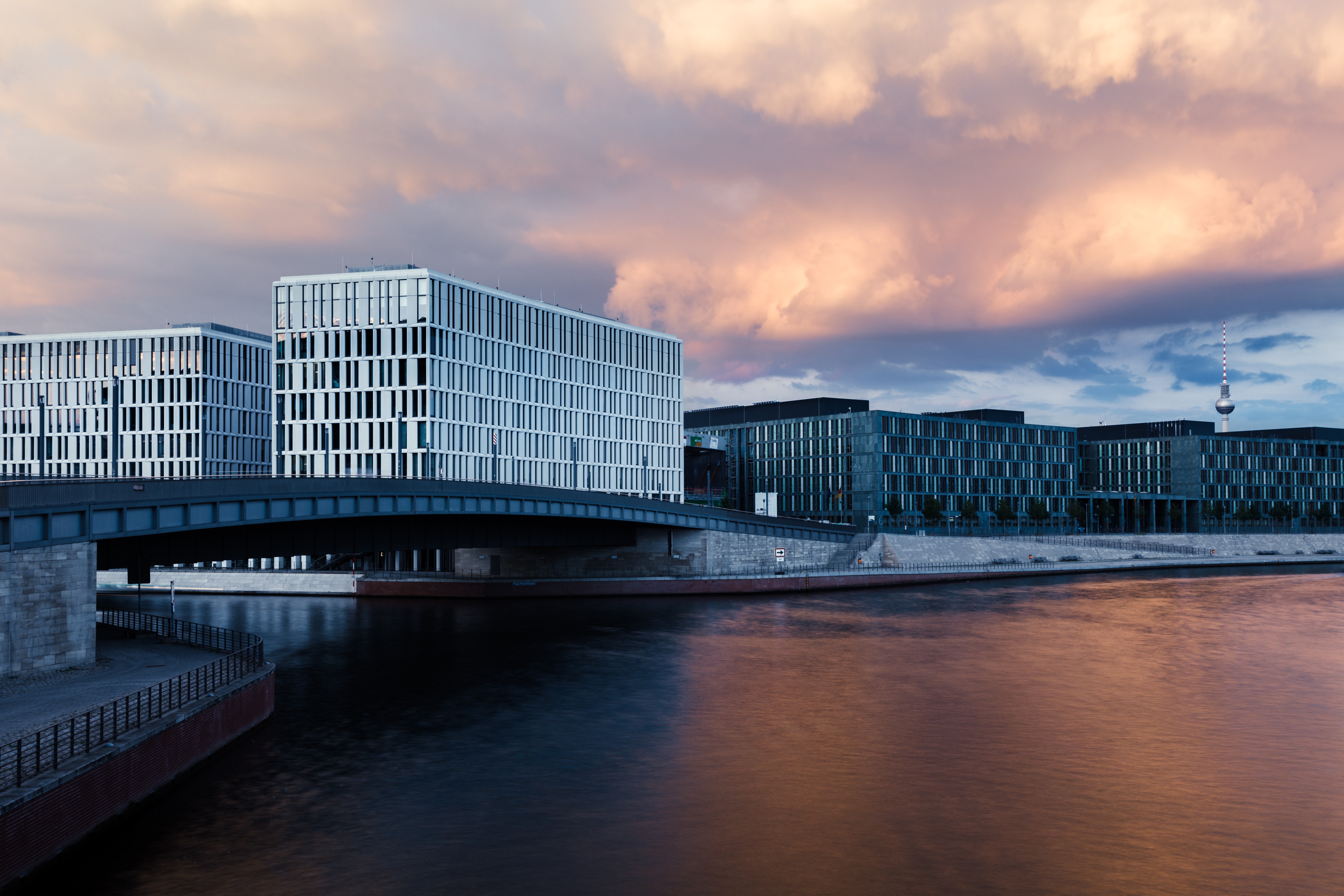 Berlin TV Tower and modern buildings along the Spree river at dusk HD Wallpaper