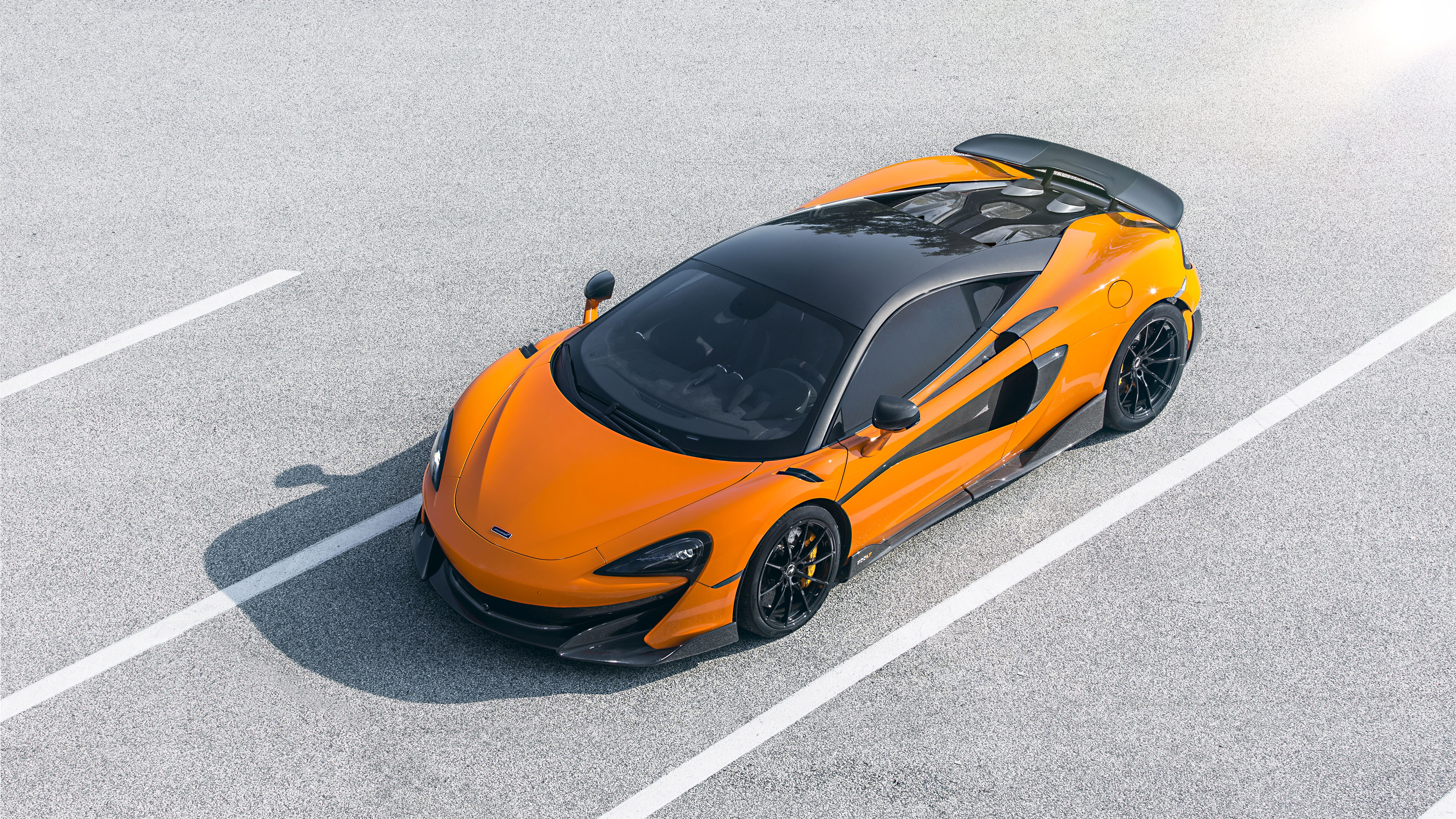 Orange McLaren 600LT Supercar on Asphalt HD Wallpaper