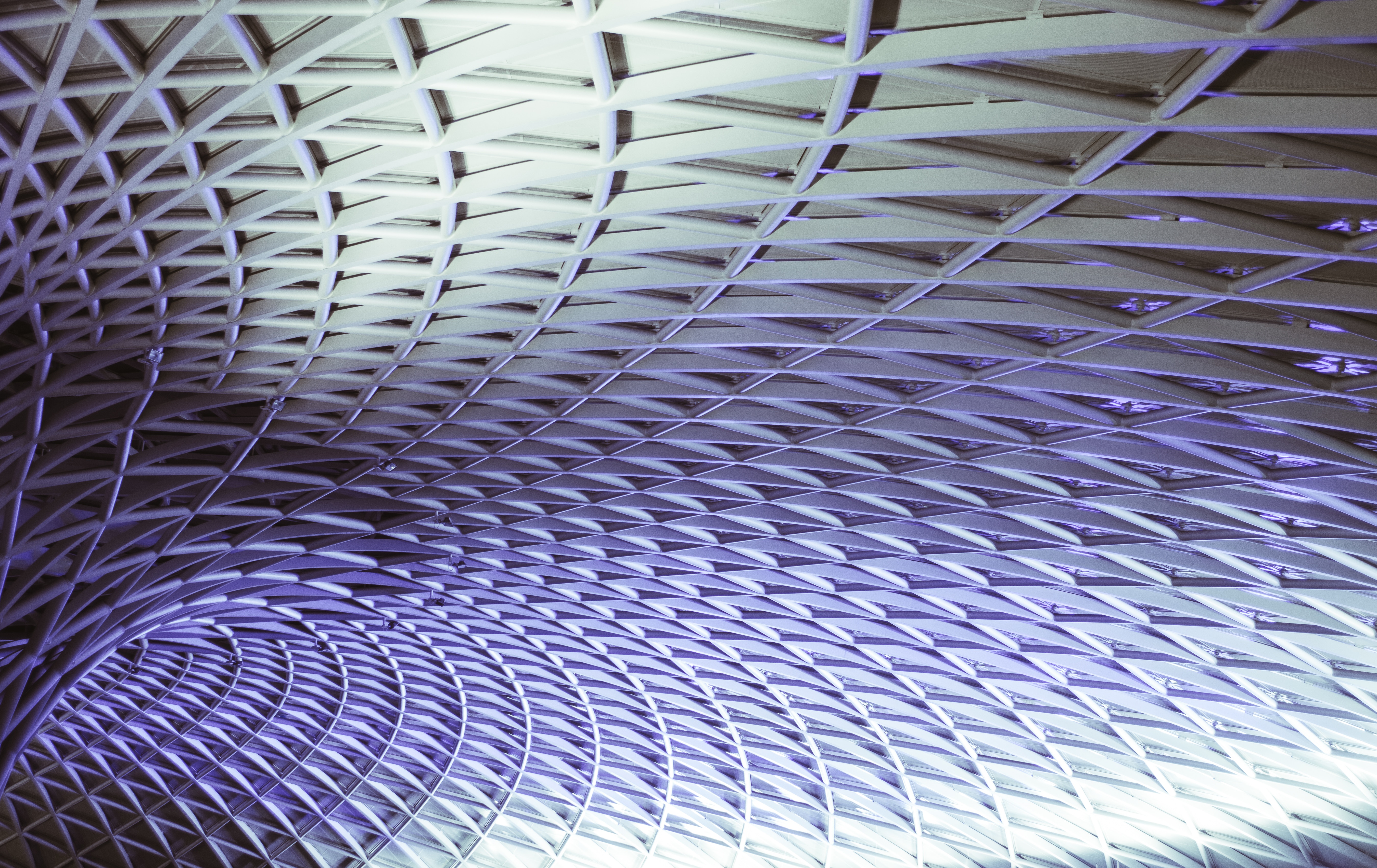 Geometric metal roof structure with purple lighting HD Wallpaper