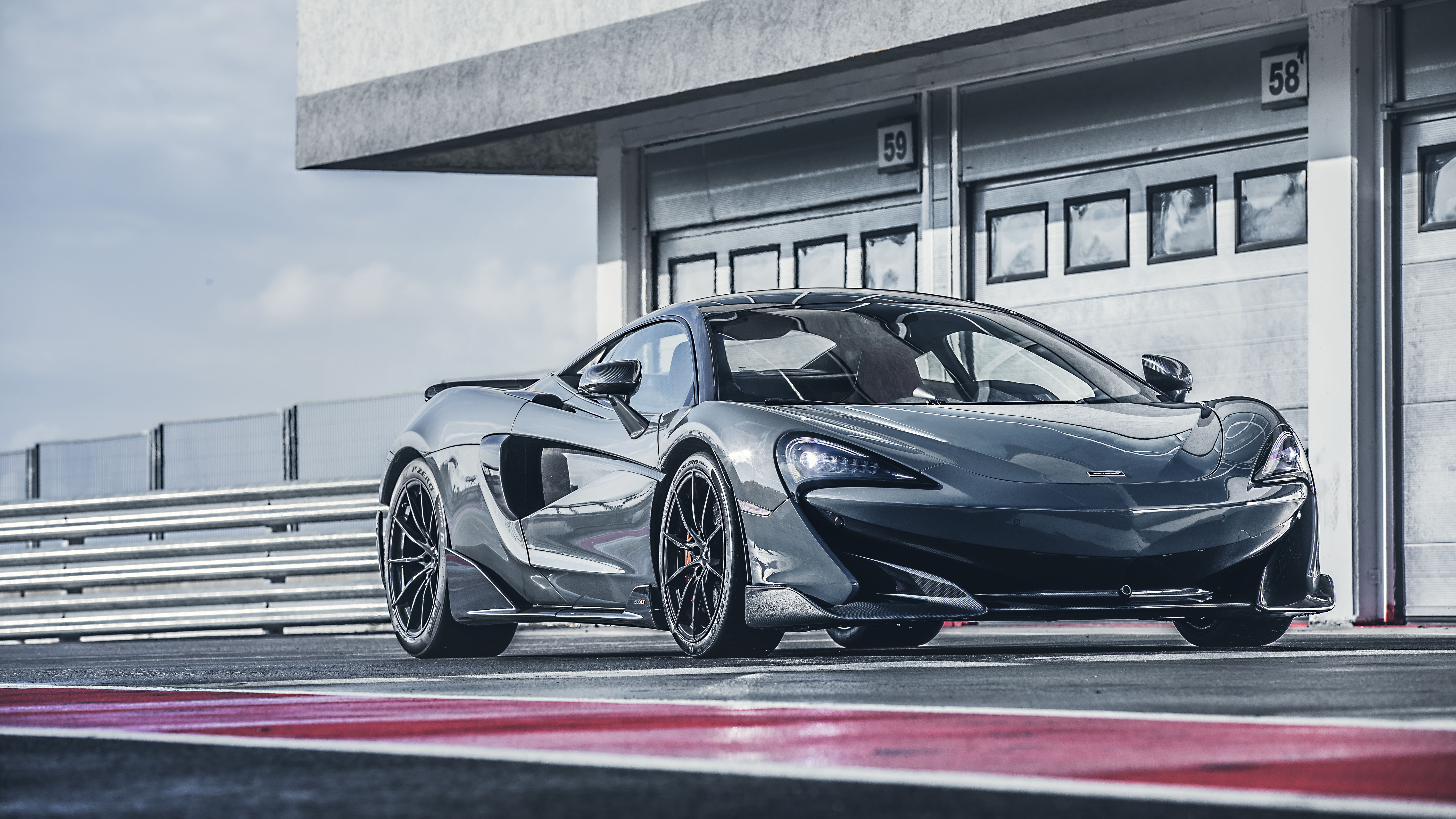 McLaren 600LT Supercar on a Racetrack HD Wallpaper