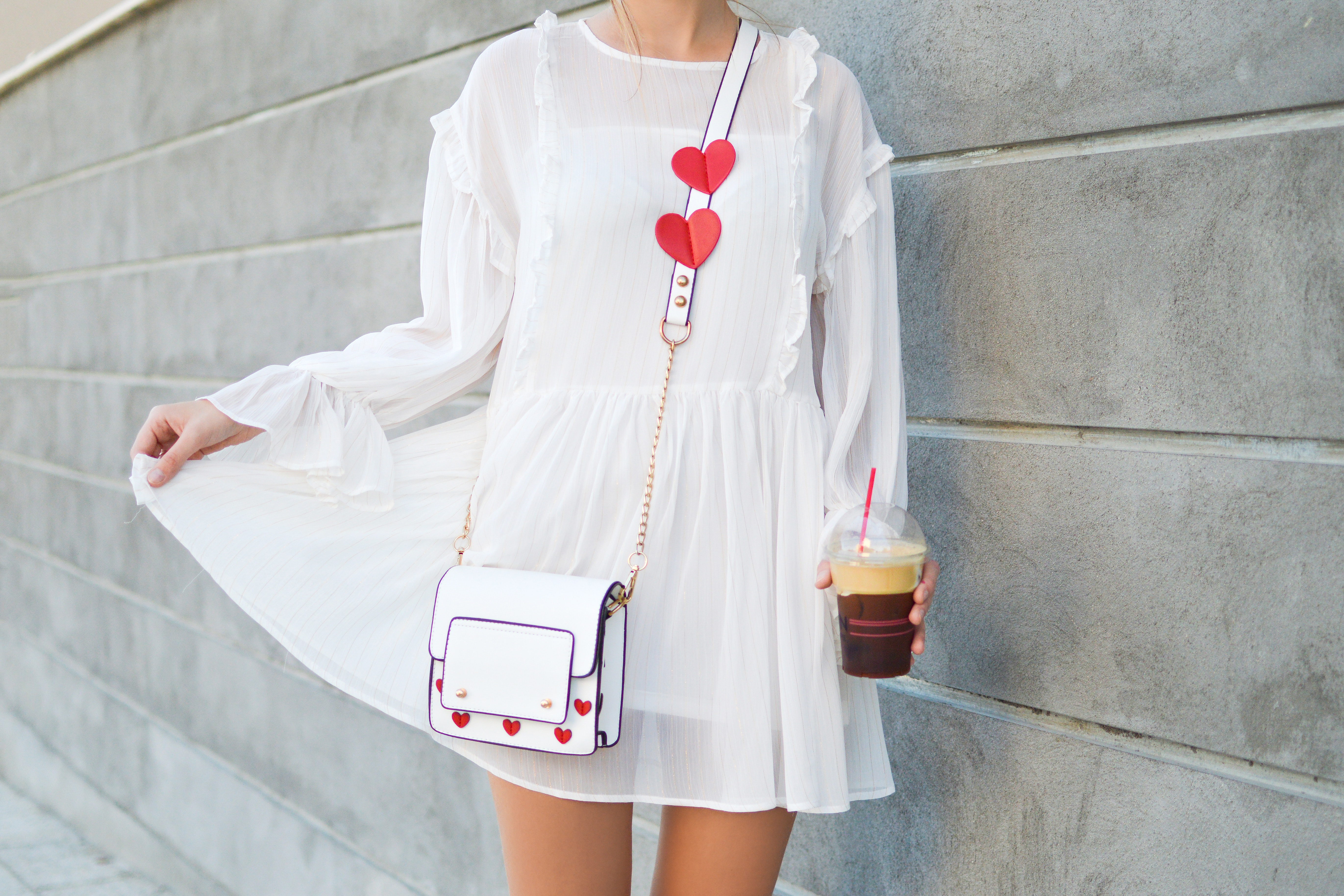 Woman in white dress with heart bag and coffee HD Wallpaper
