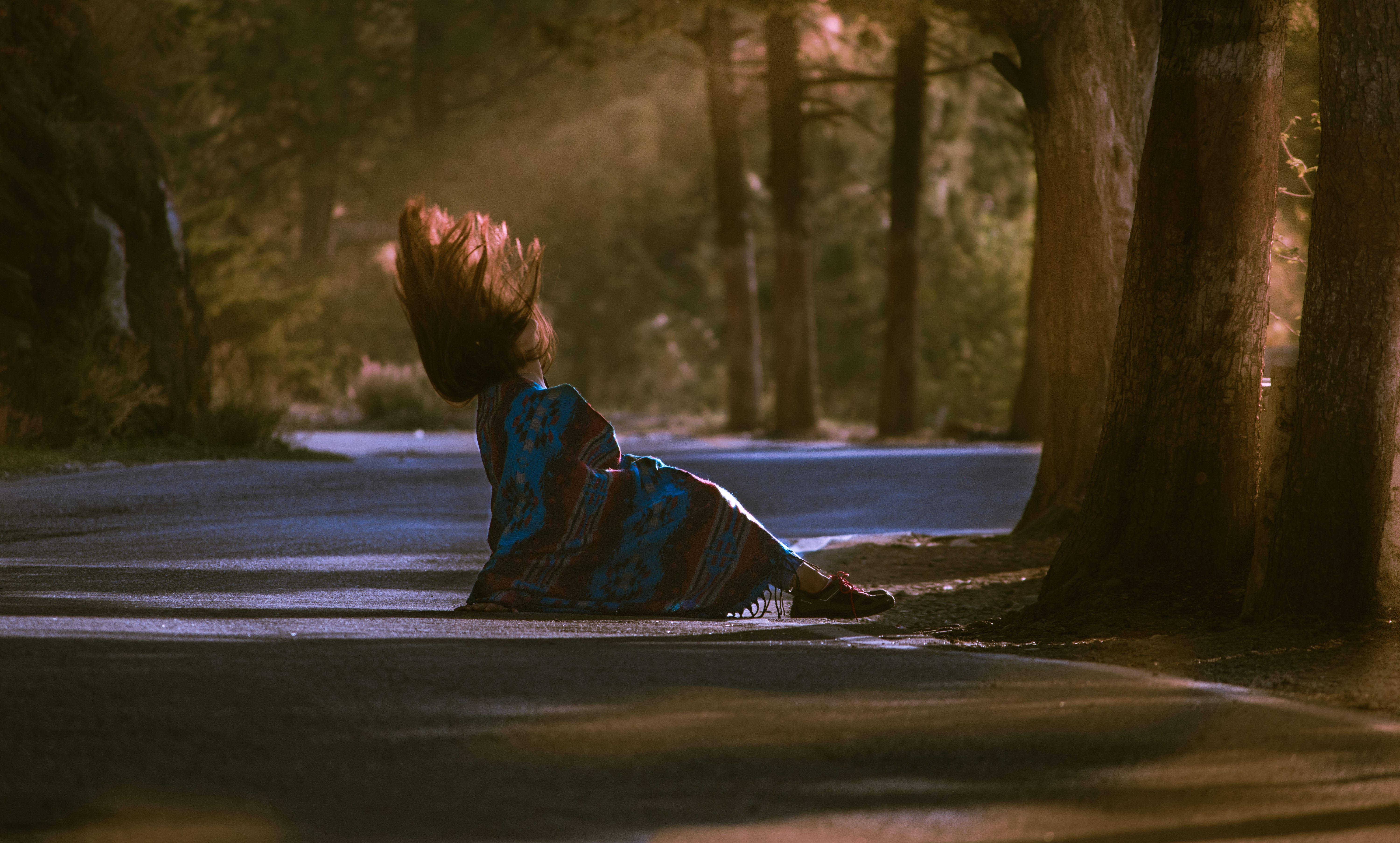Woman with hair in the air on a road HD Wallpaper