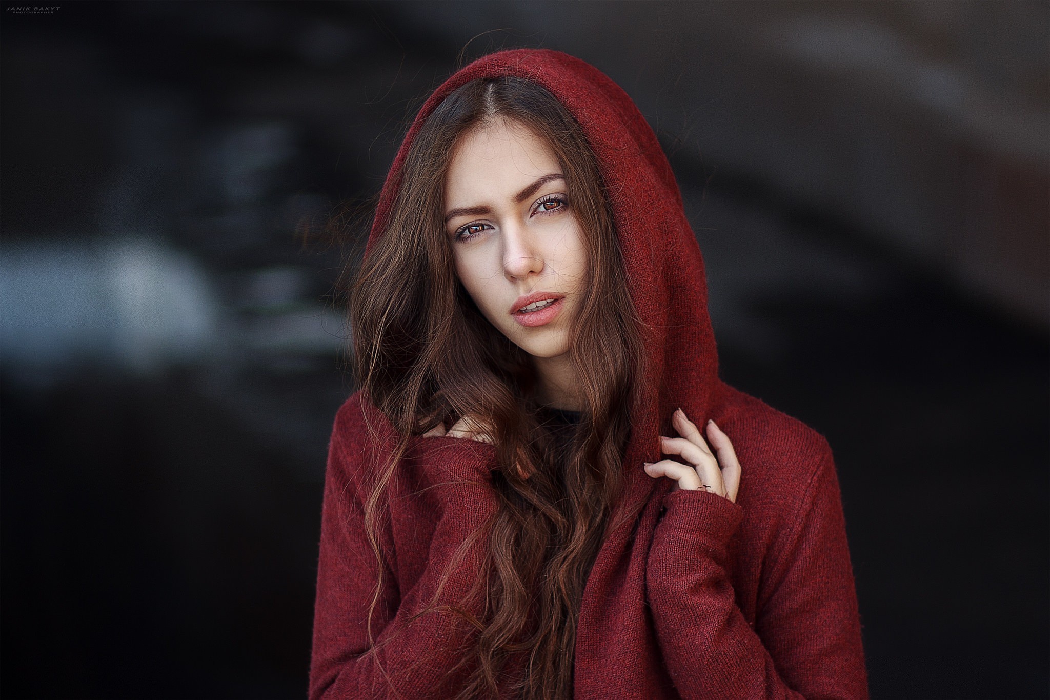 Woman with long brown hair wearing a red hood HD Wallpaper