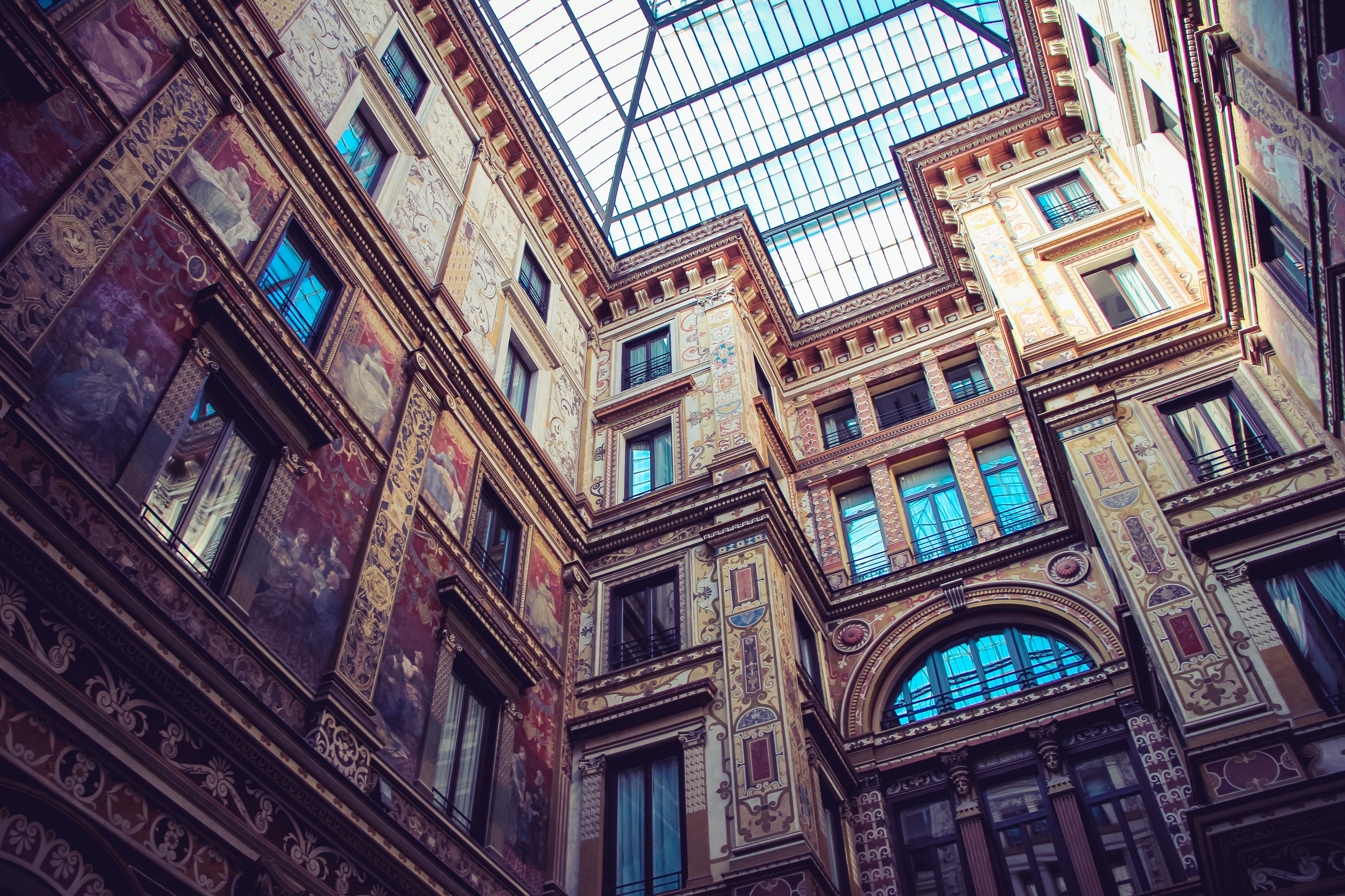 Courtyard with ornate facade and skylight HD Wallpaper