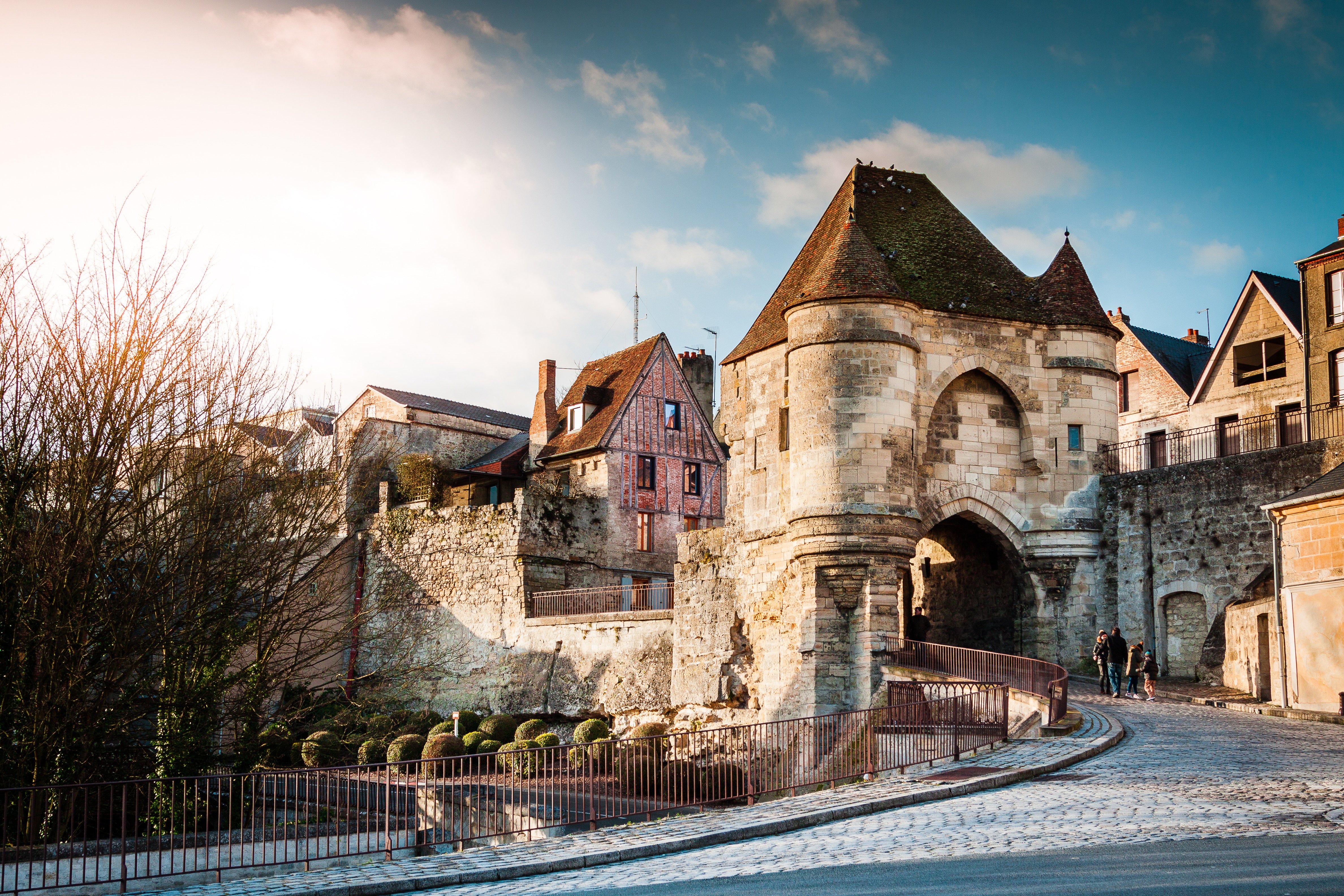 Ancient stone archway entrance to a historic village HD Wallpaper