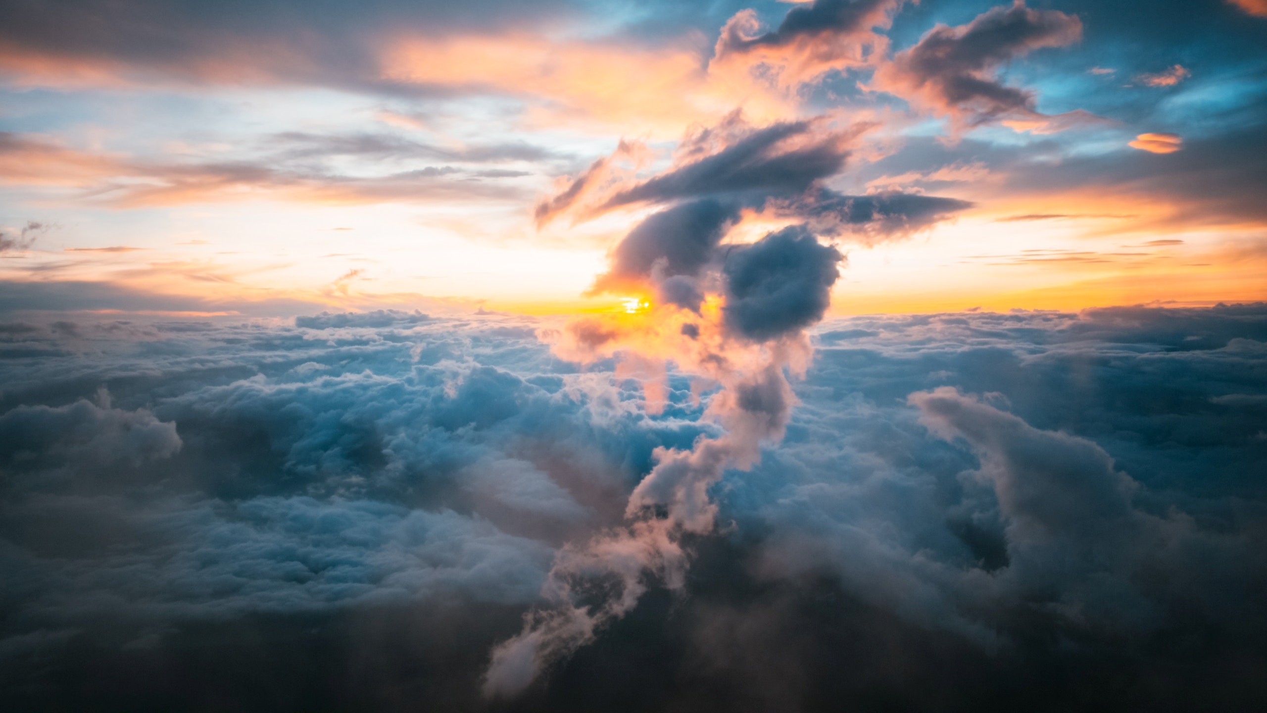 Sunrise over clouds with dramatic cloud formations HD Wallpaper