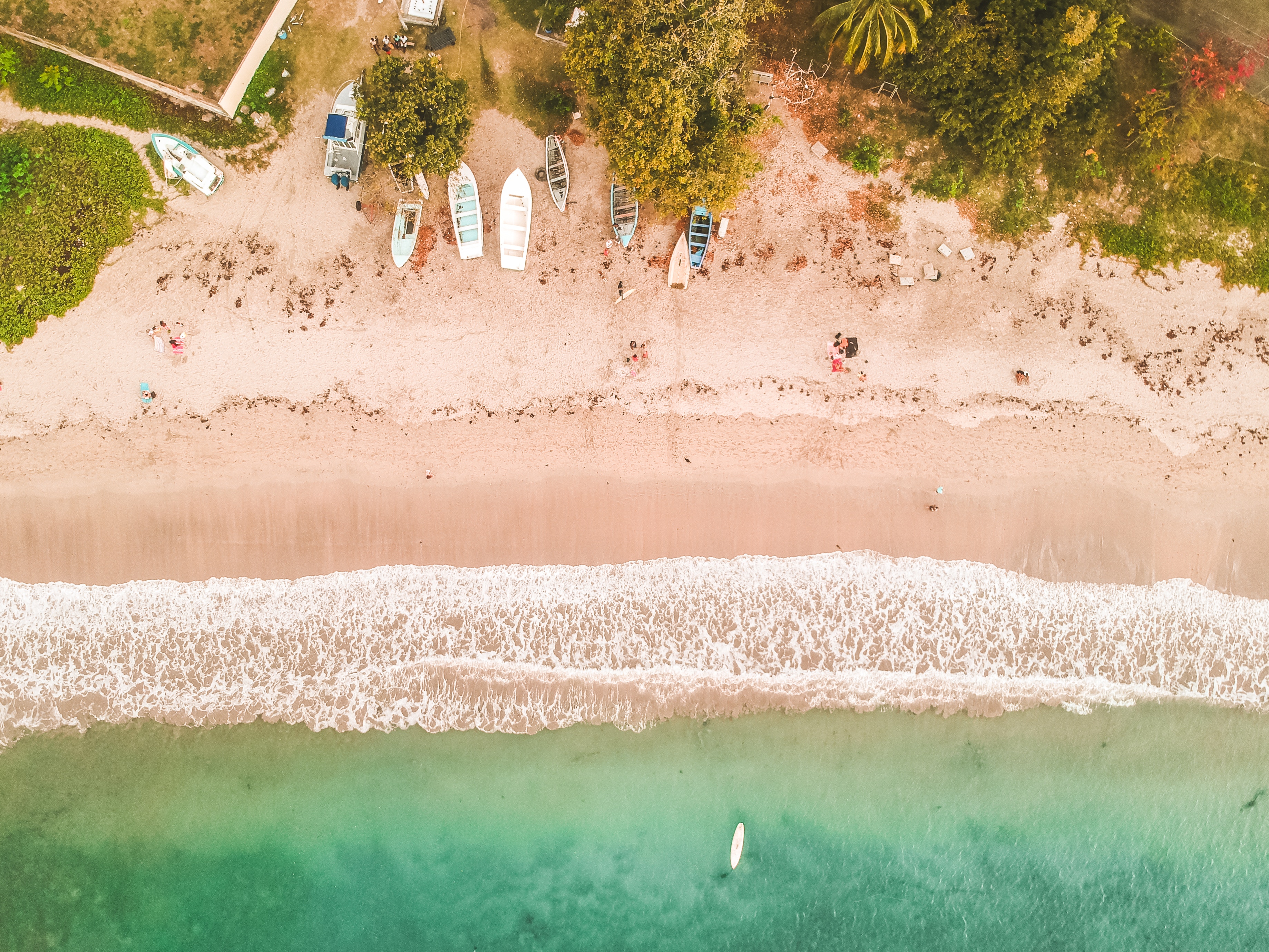 Aerial view of a tropical beach with boats and ocean HD Wallpaper