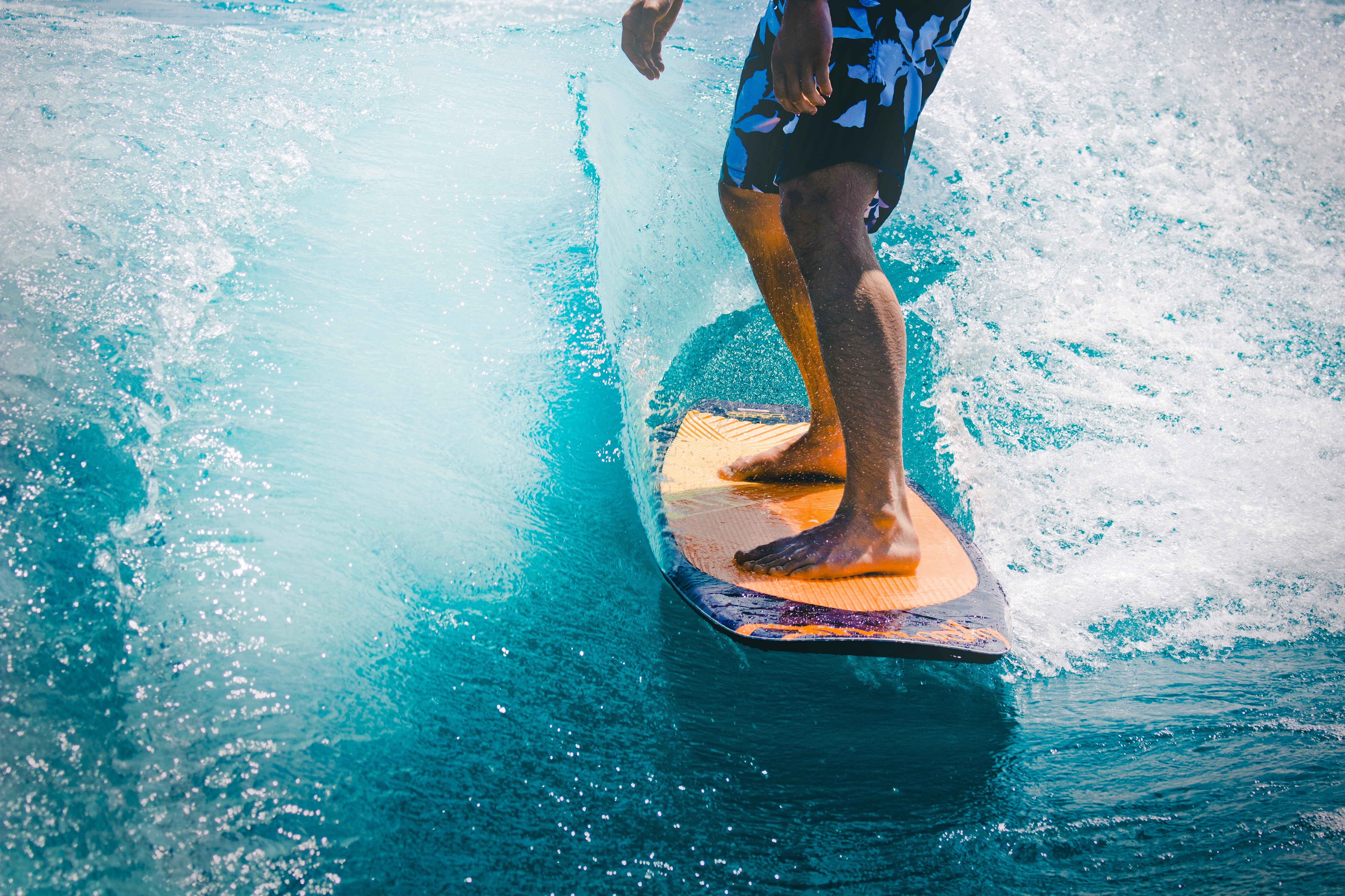 Man wakesurfing on a blue wave HD Wallpaper