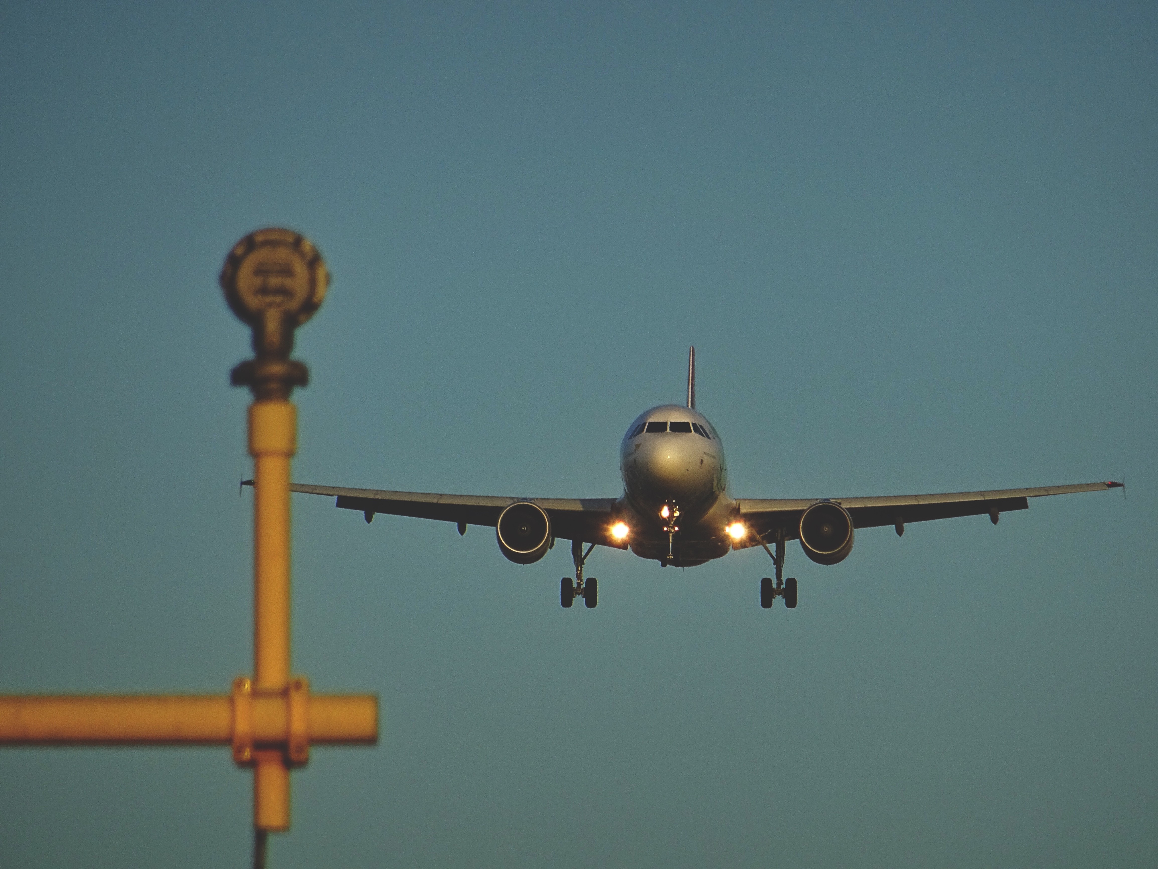Airplane landing with runway lights HD Wallpaper