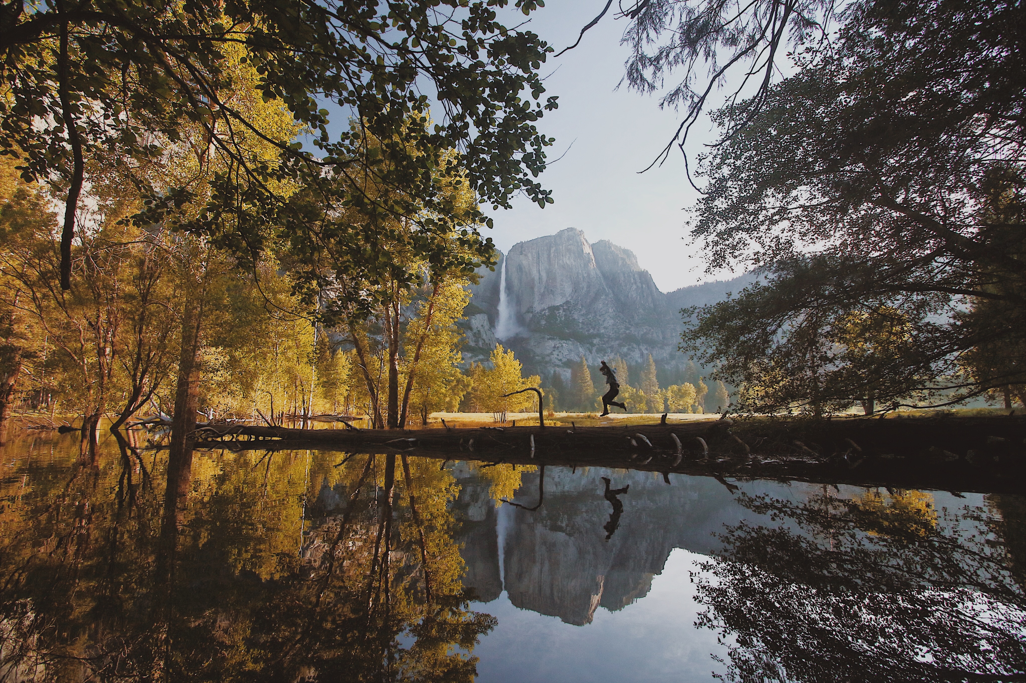 Person running by Yosemite waterfall reflection HD Wallpaper