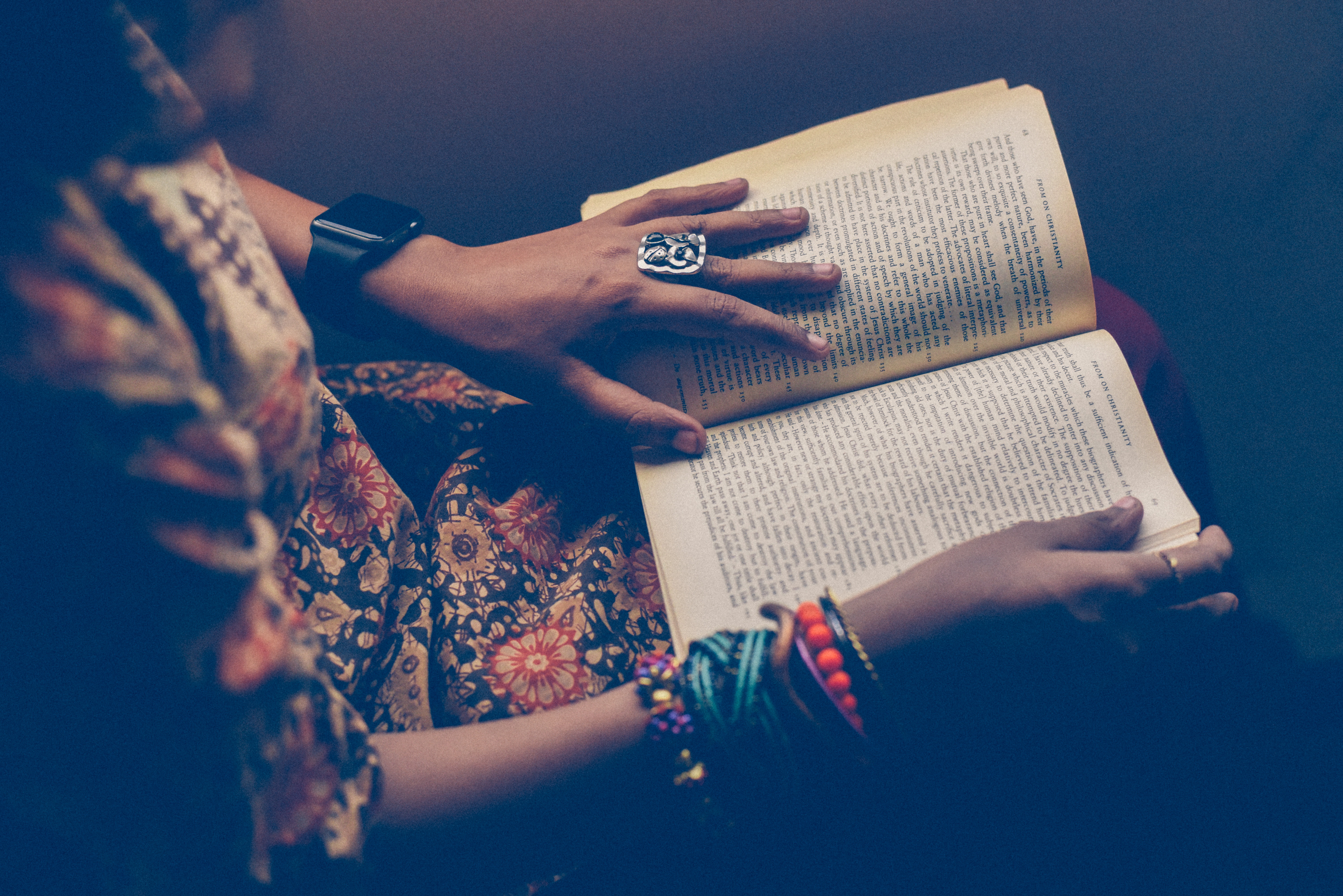 Person reading a book with jewelry HD Wallpaper