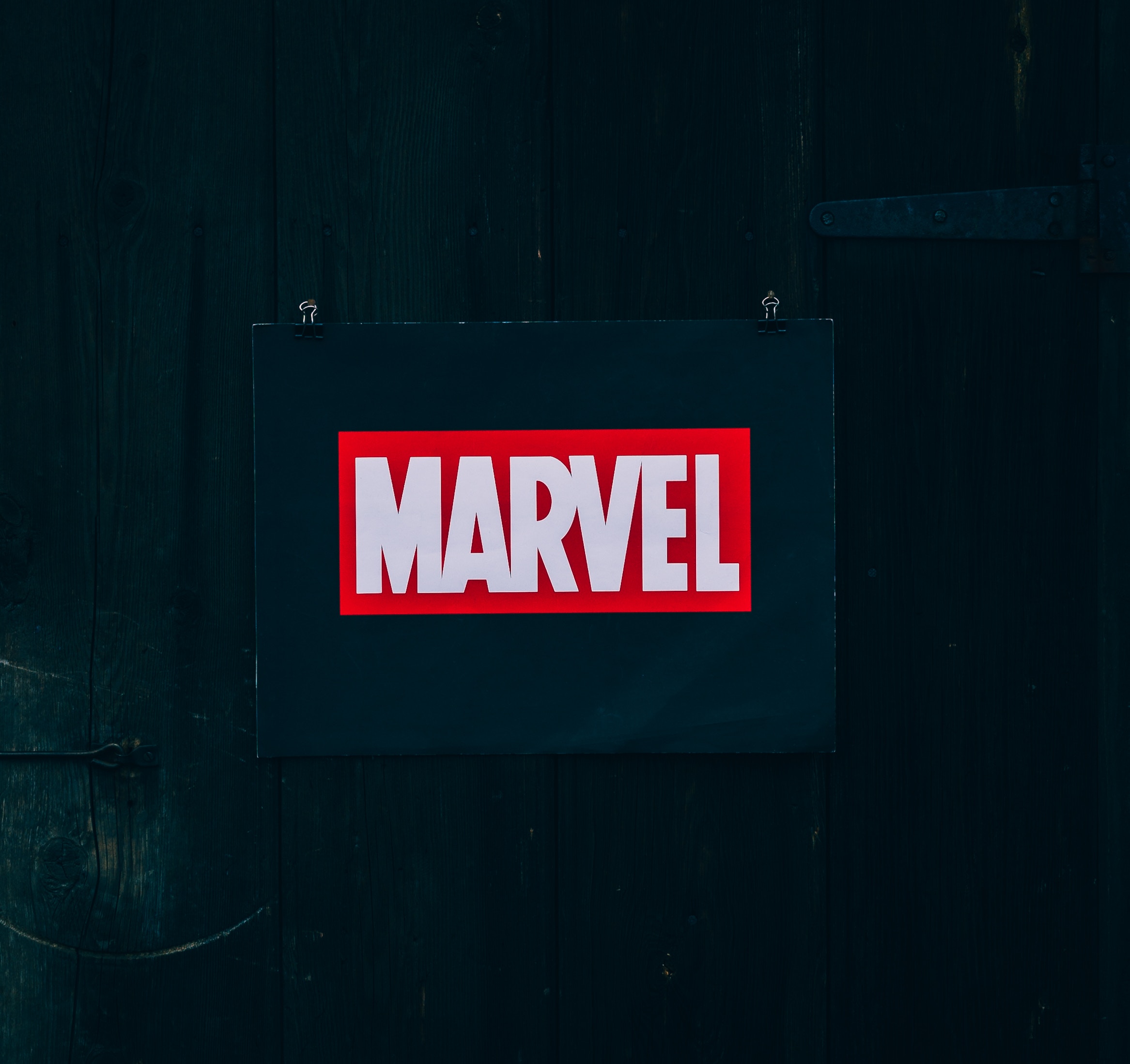 Marvel logo on a dark wooden door HD Wallpaper
