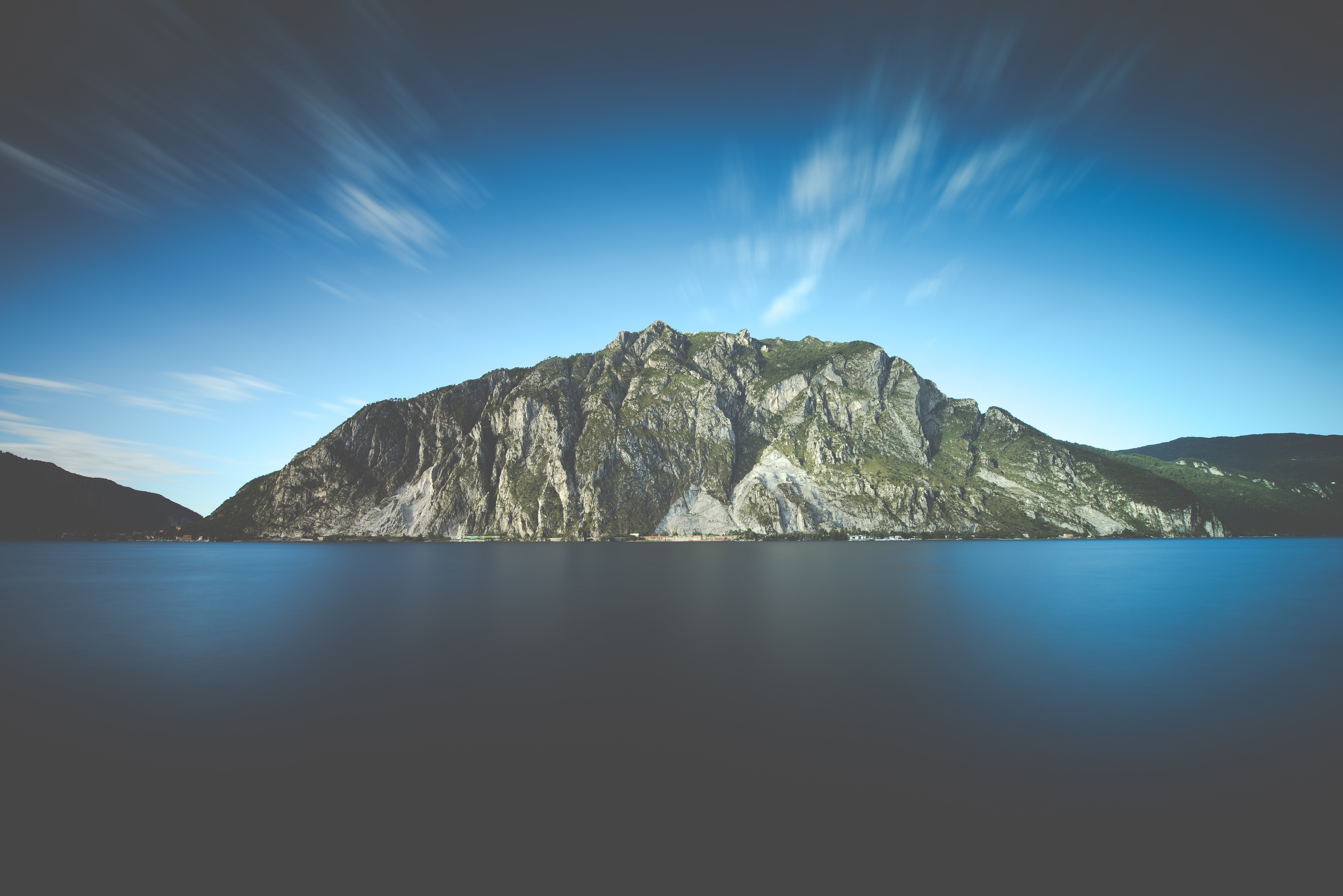 Mountain and lake with long exposure clouds HD Wallpaper