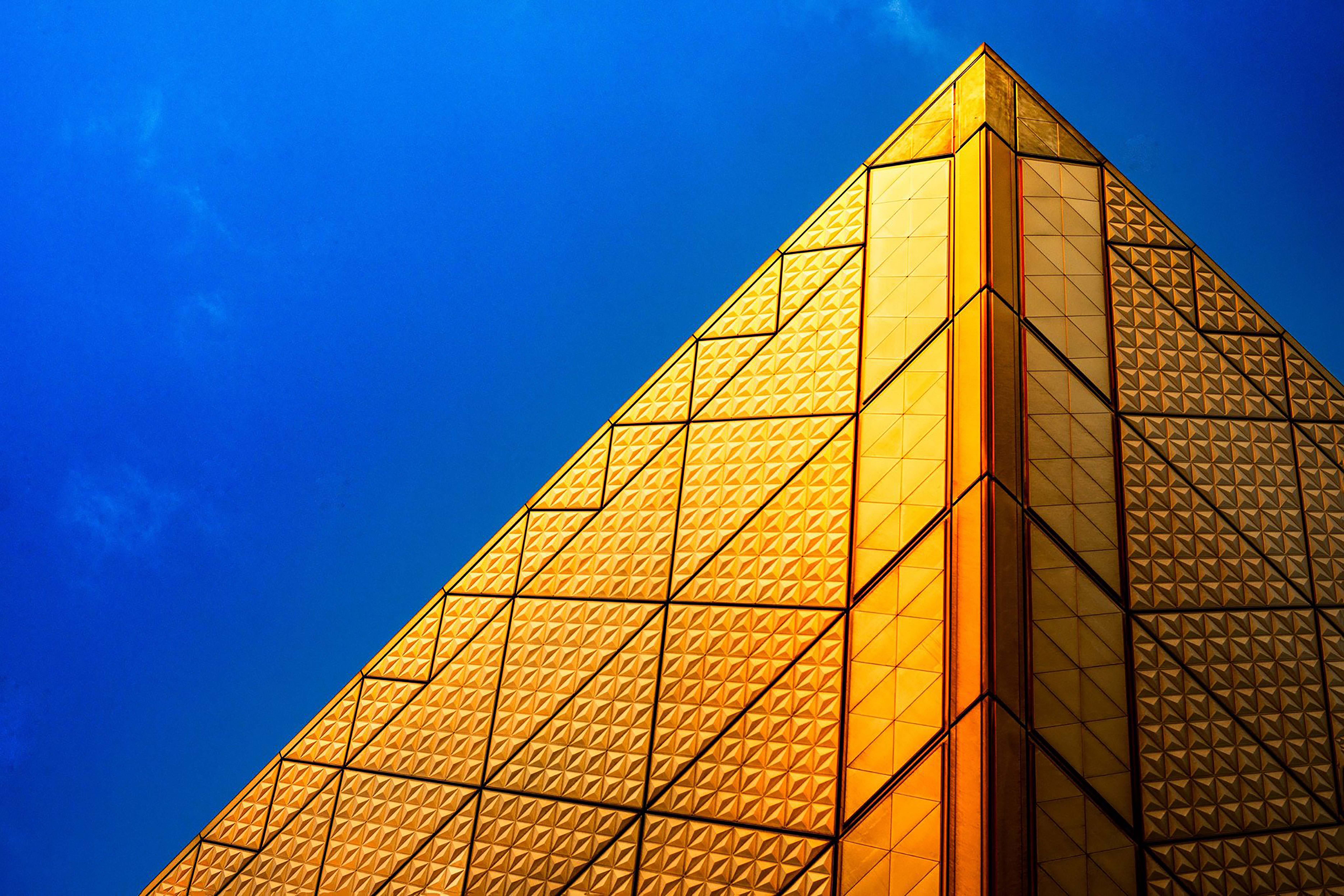 Golden Pyramid Facade Against Blue Sky in Tokyo HD Wallpaper