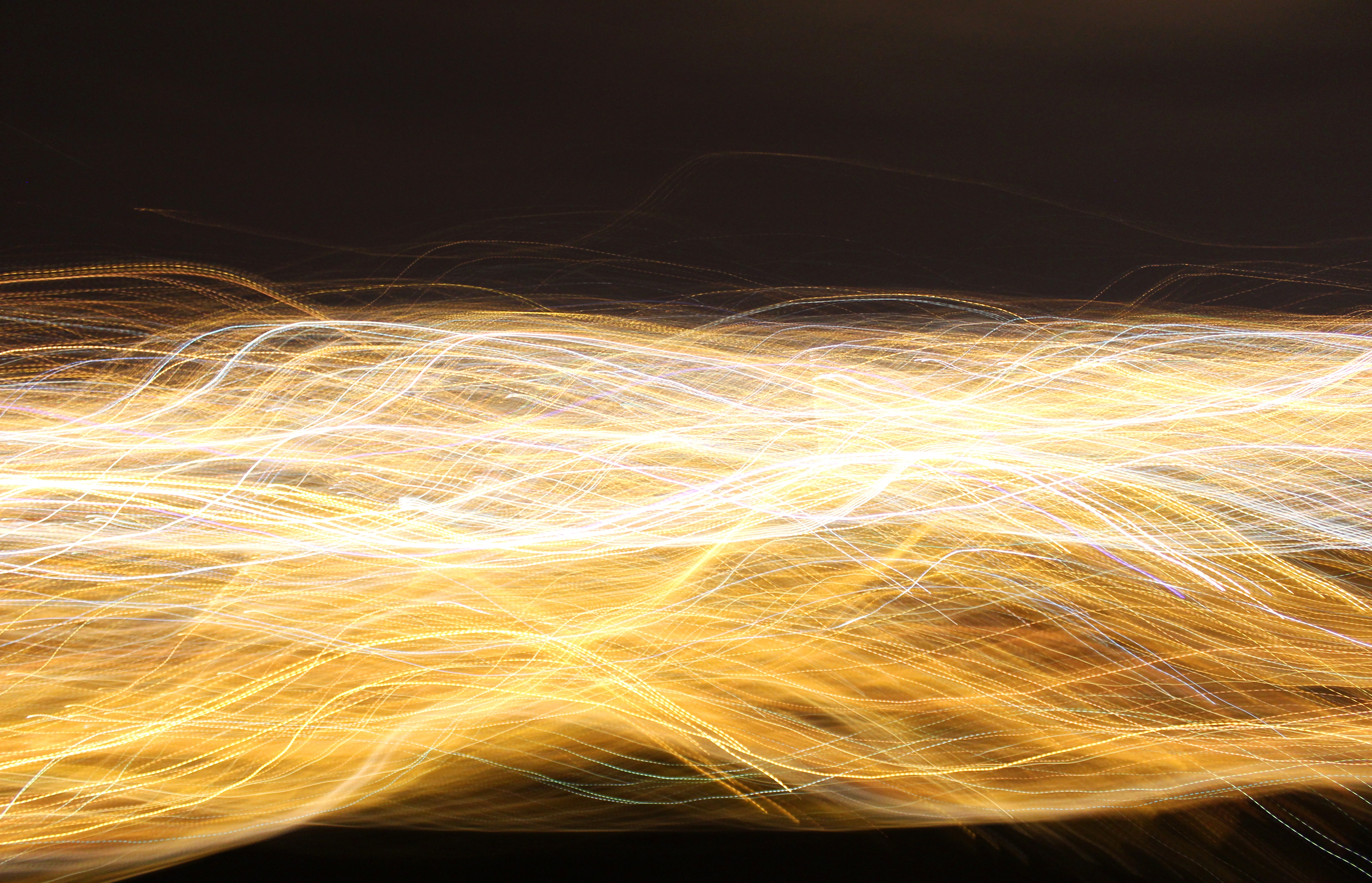 Abstract light trails in yellow and white HD Wallpaper