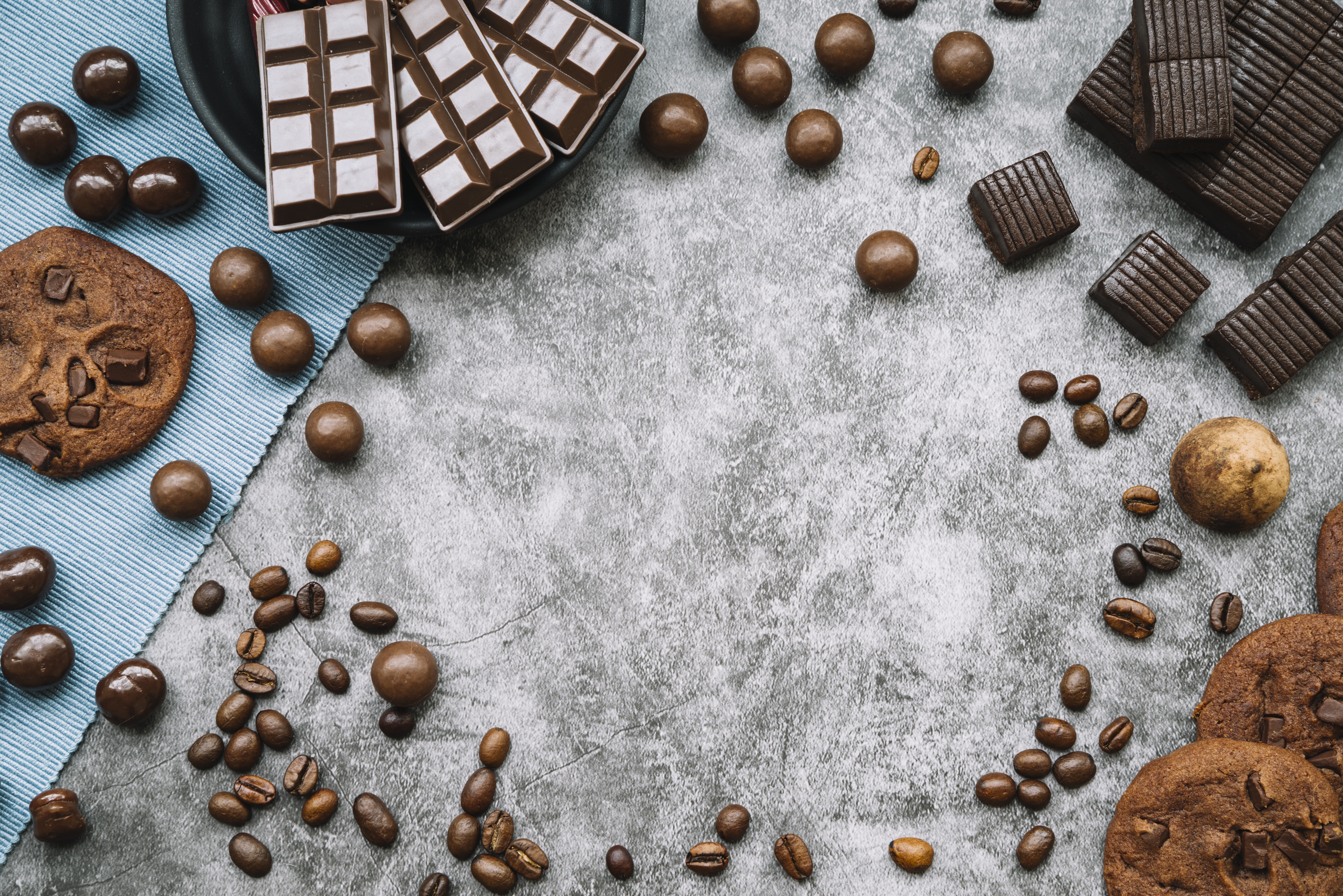 Still life of chocolates, cookies, and coffee beans HD Wallpaper