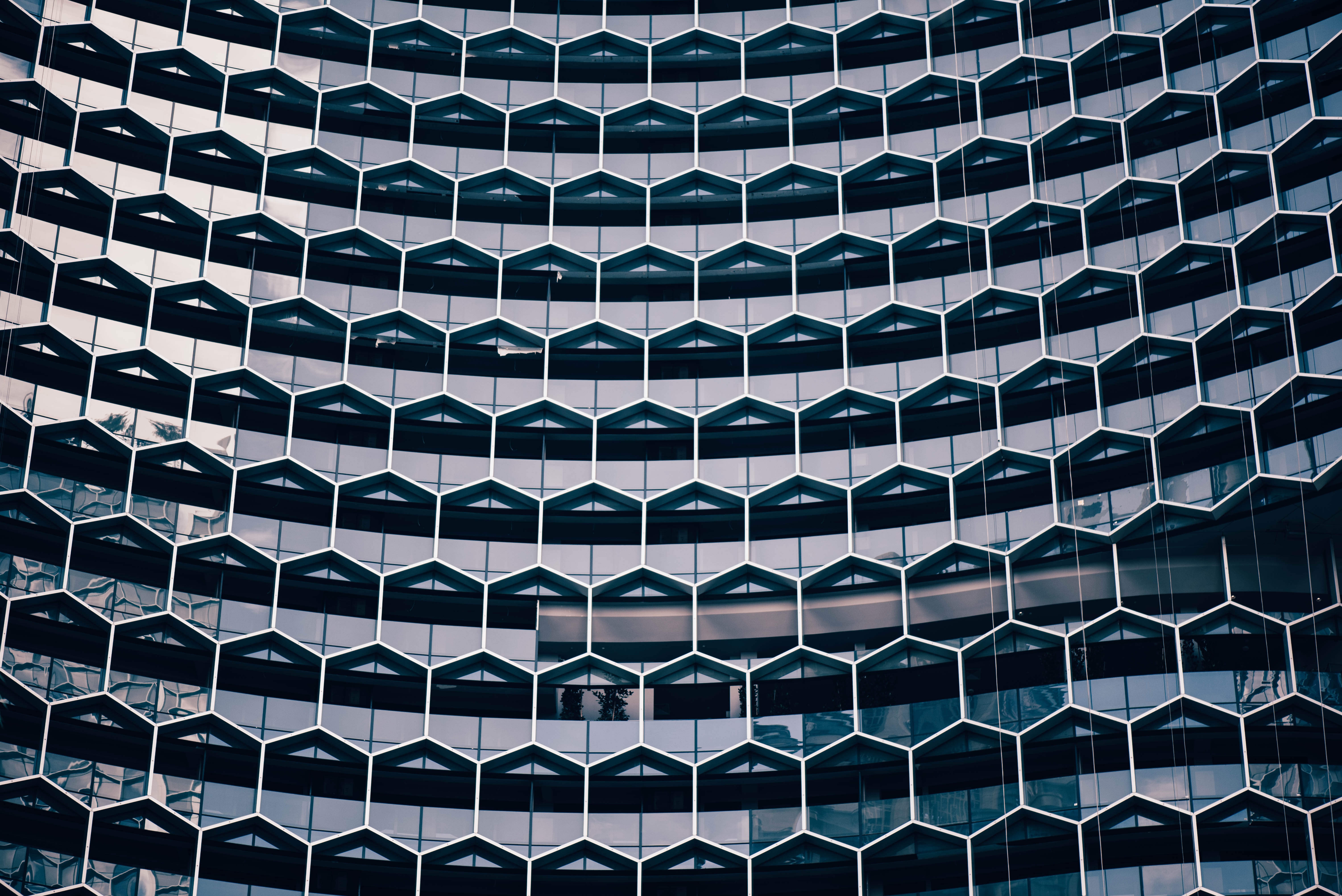 Geometric building facade with hexagonal windows HD Wallpaper
