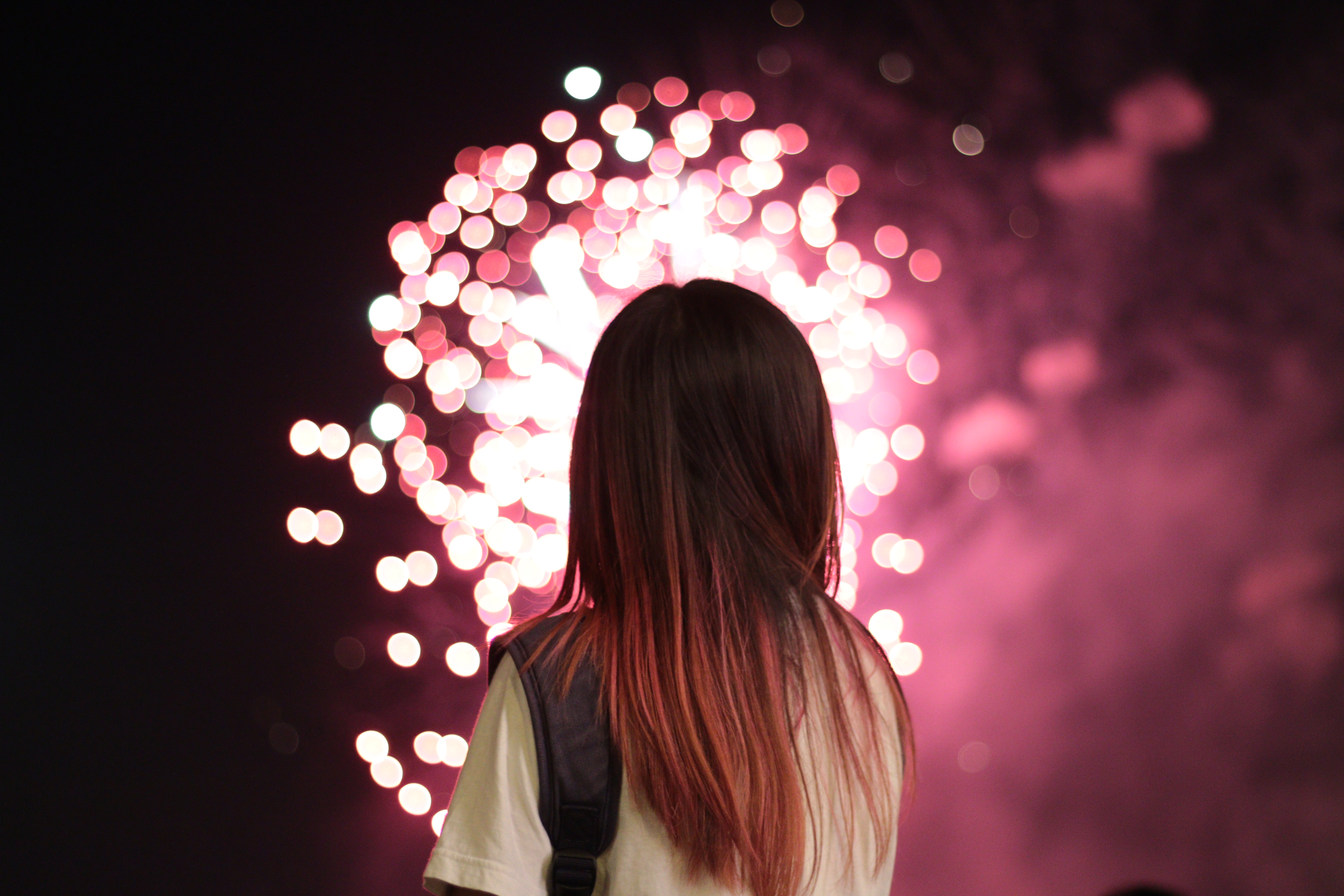 Woman Watching Pink Fireworks in Cambodia Night HD Wallpaper