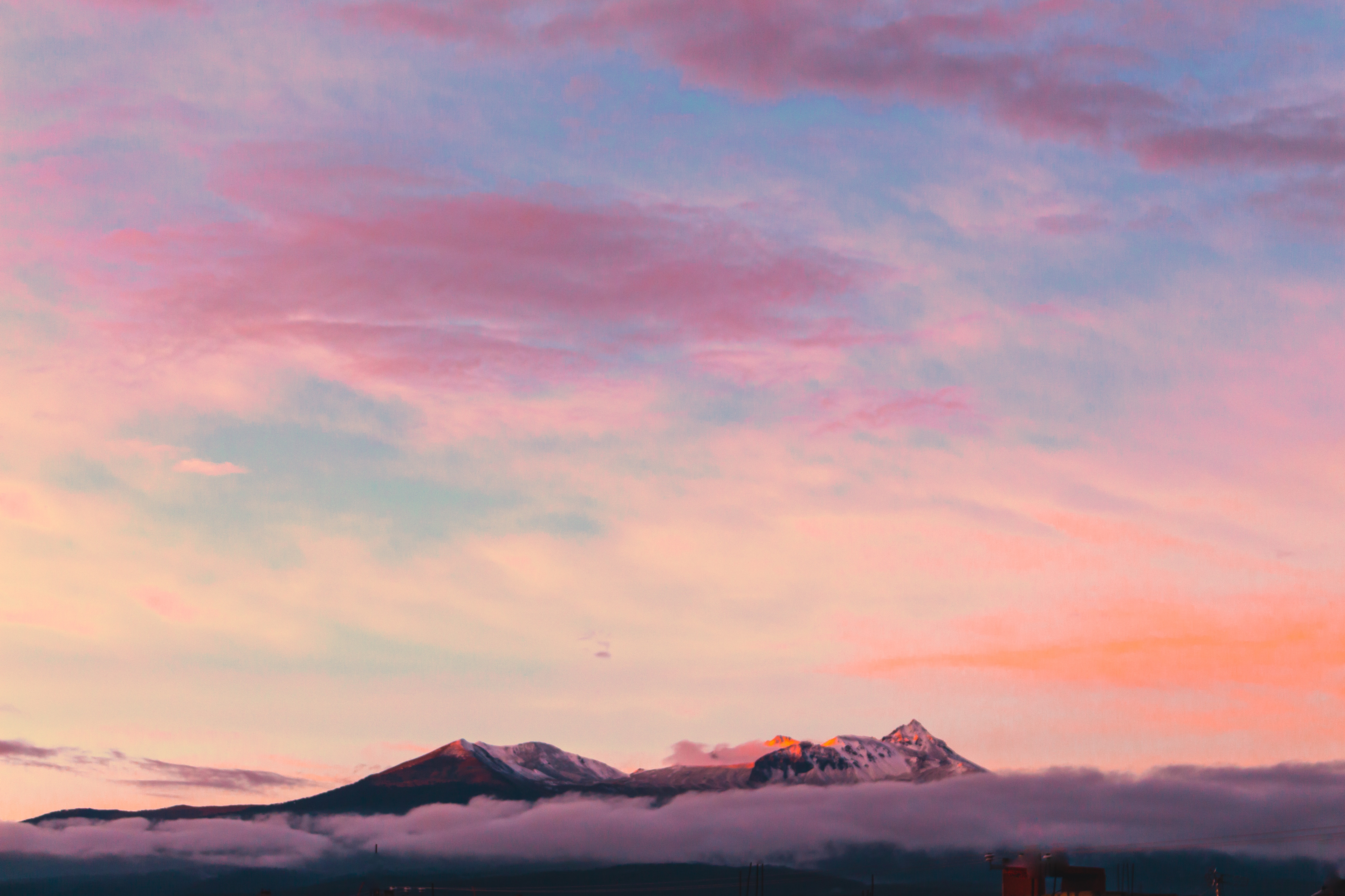 Snow-capped mountains at sunset with pink clouds HD Wallpaper