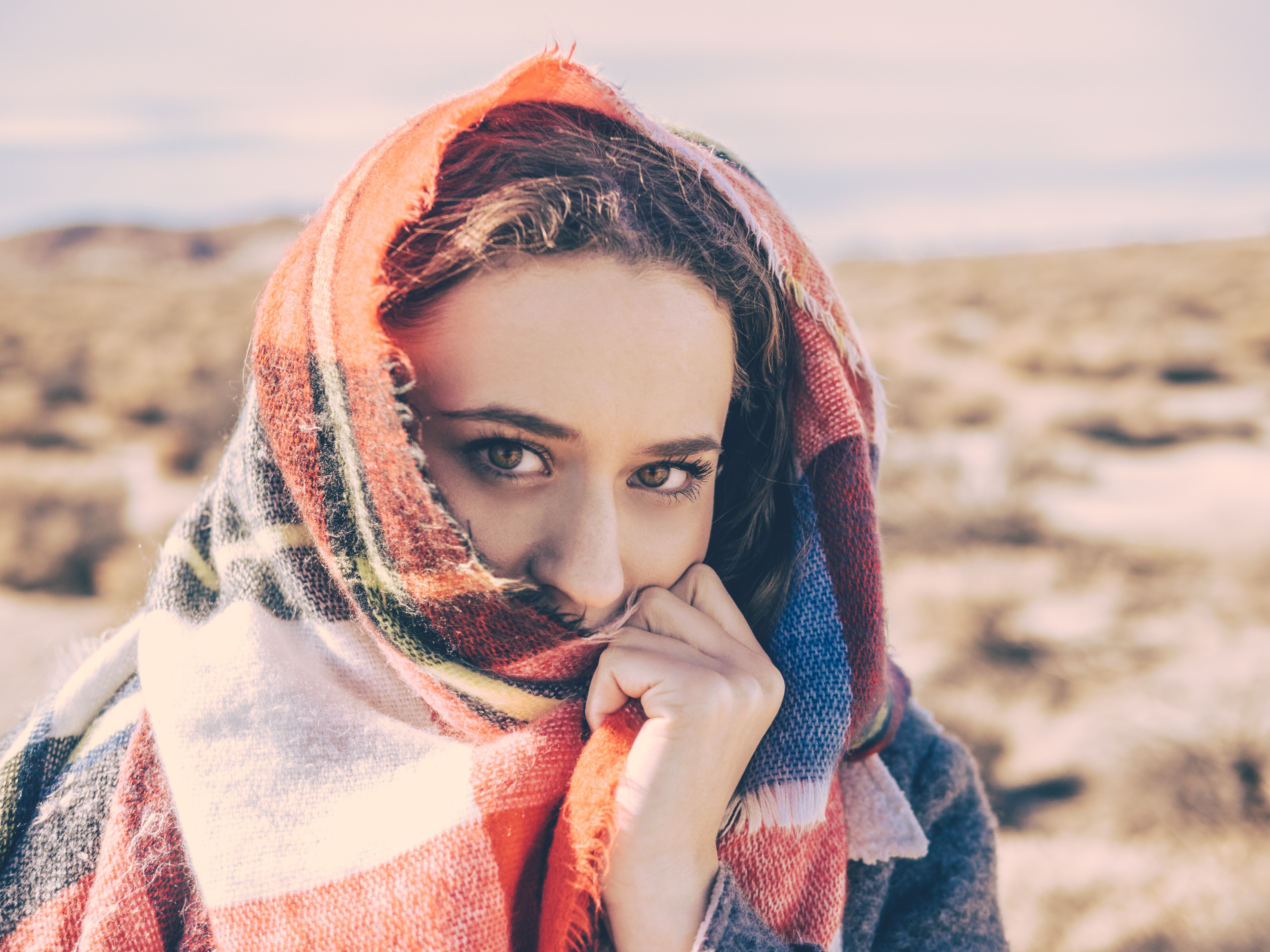 Woman in a colorful scarf in the desert HD Wallpaper