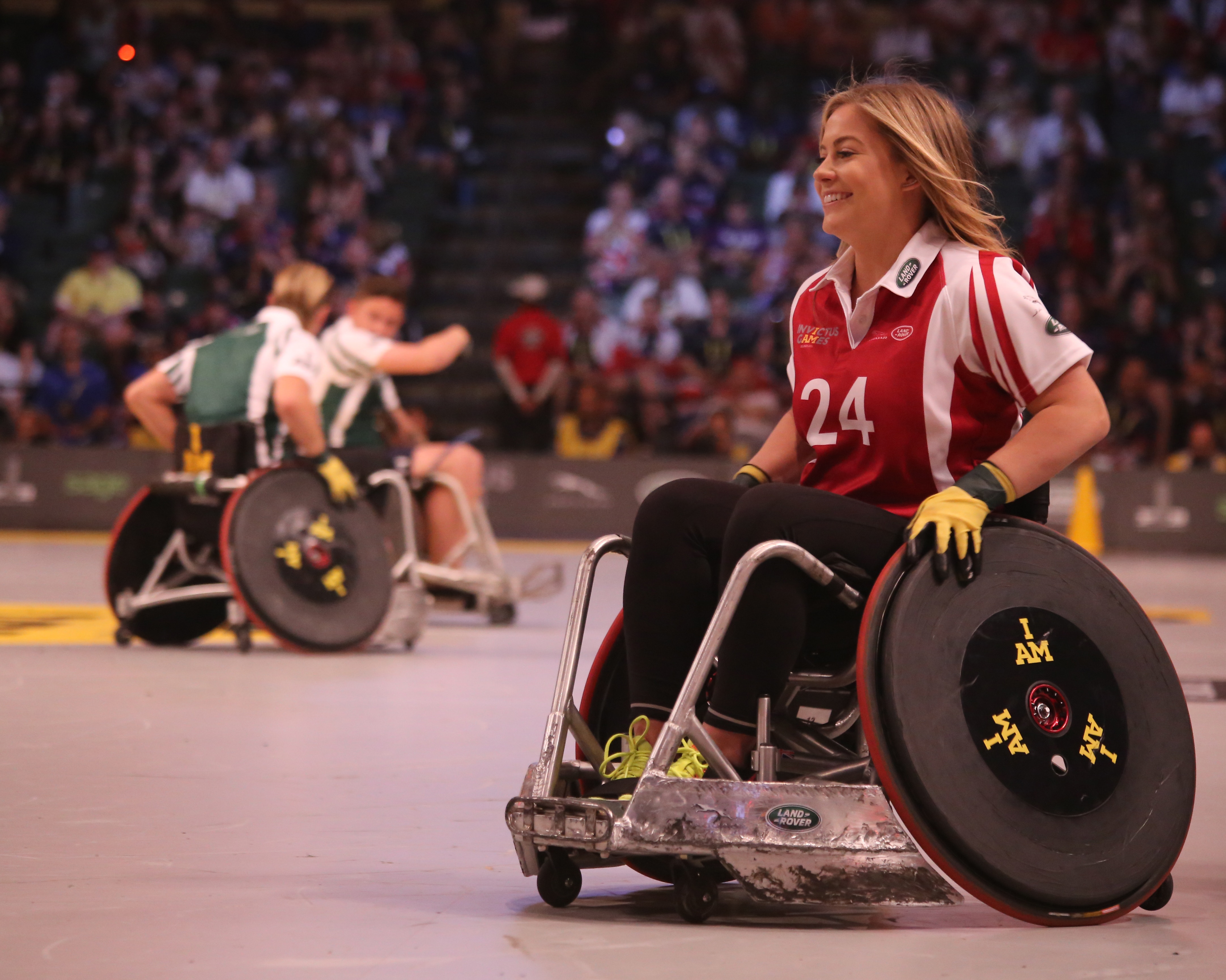Woman in wheelchair with number 24 on jersey HD Wallpaper