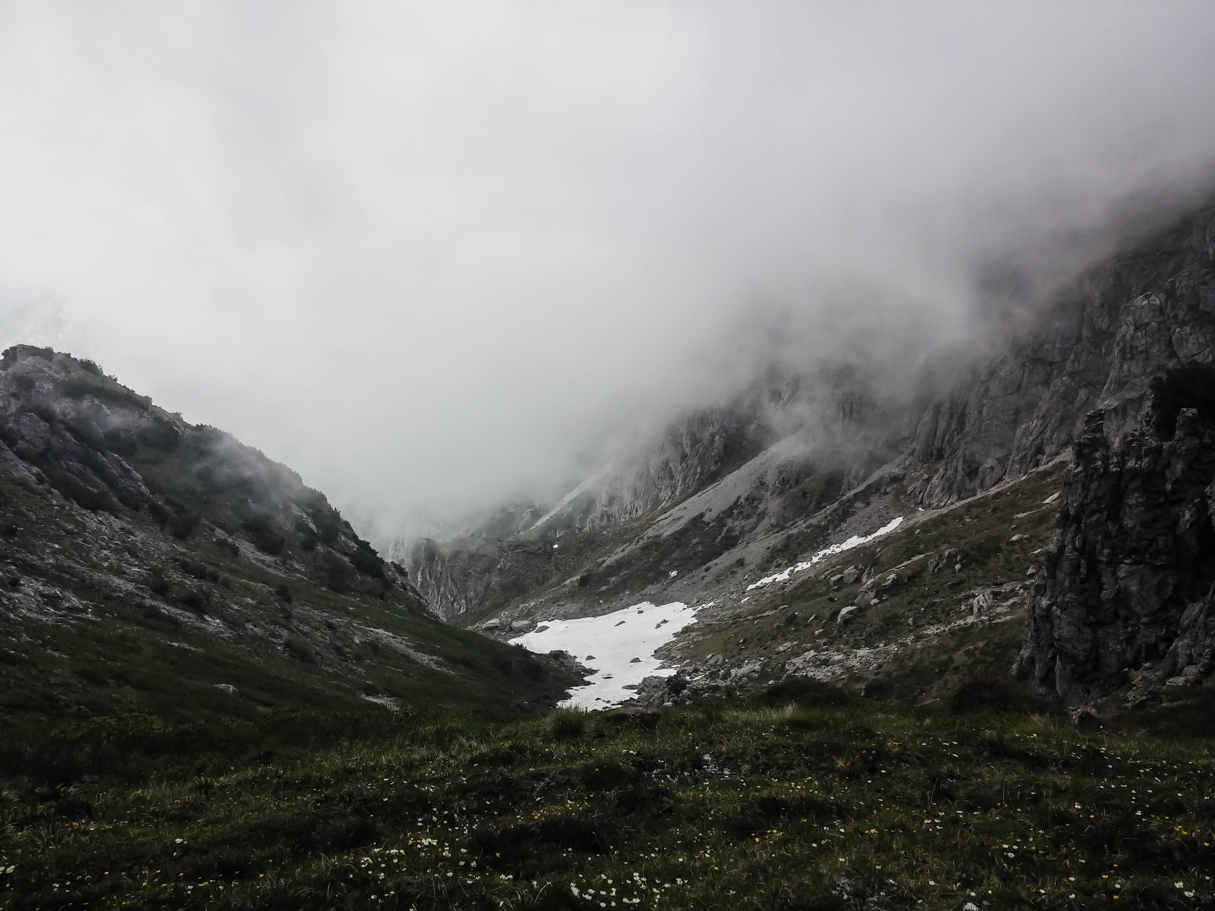 Foggy Mountain Valley with Snow Patches HD Wallpaper