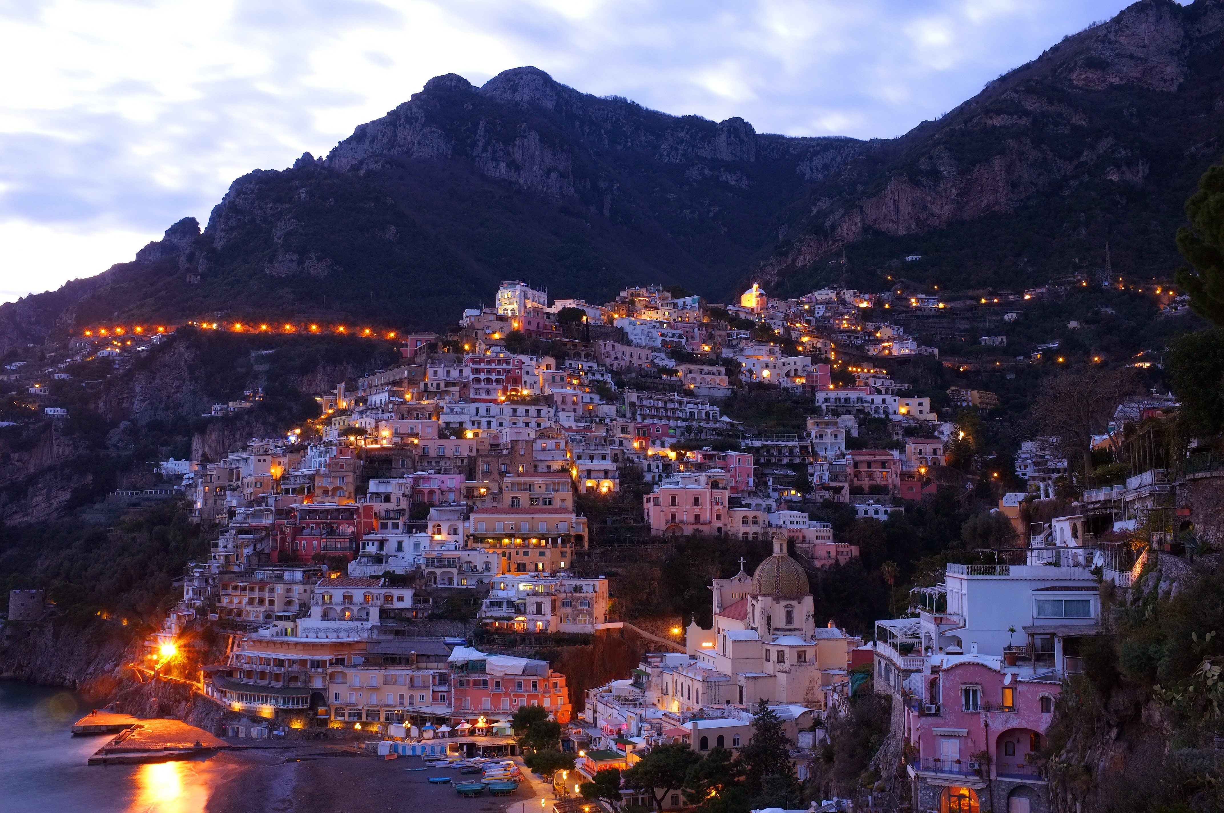 Positano village on a cliffside at dusk HD Wallpaper