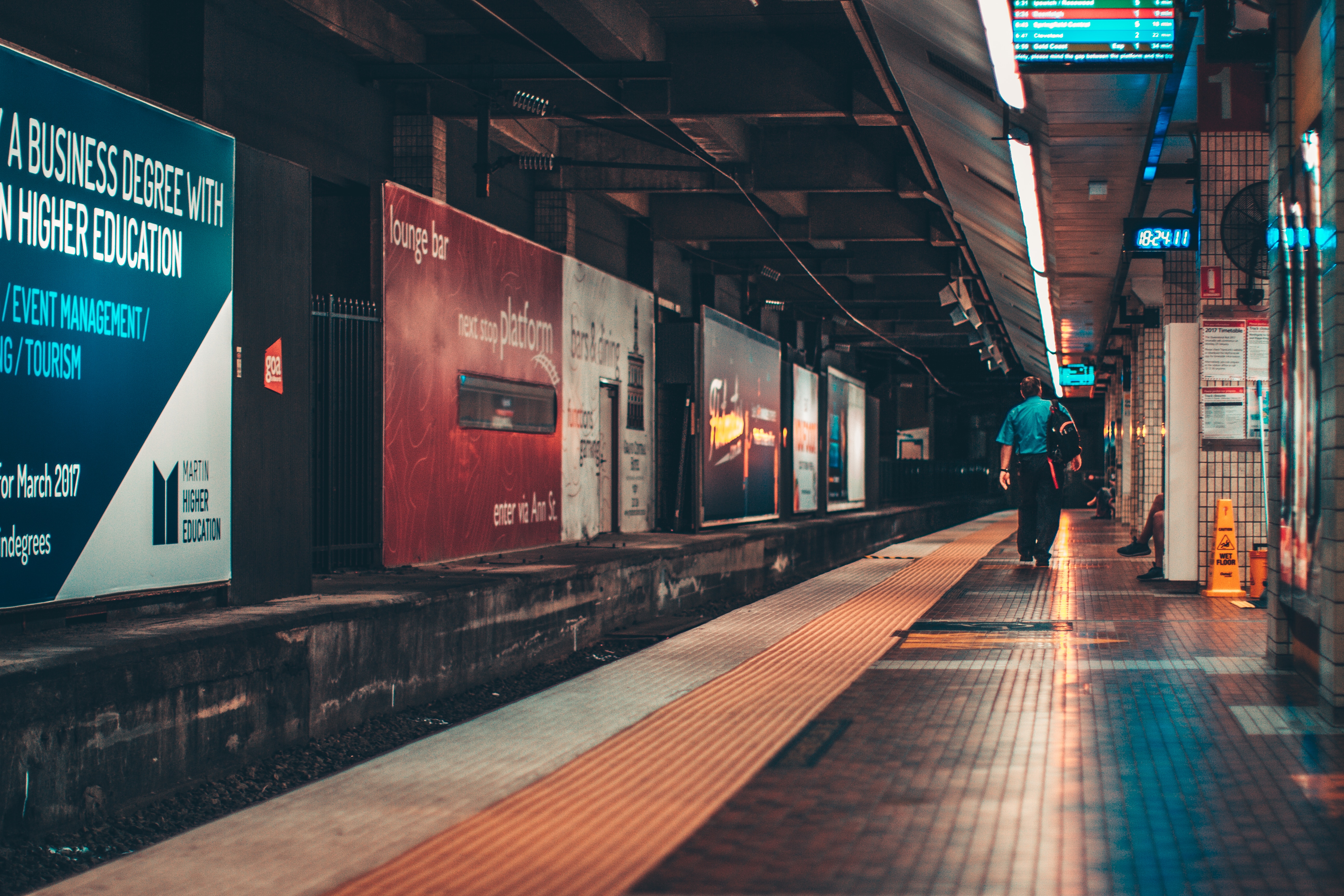 Quiet Underground Train Platform with Commuter HD Wallpaper