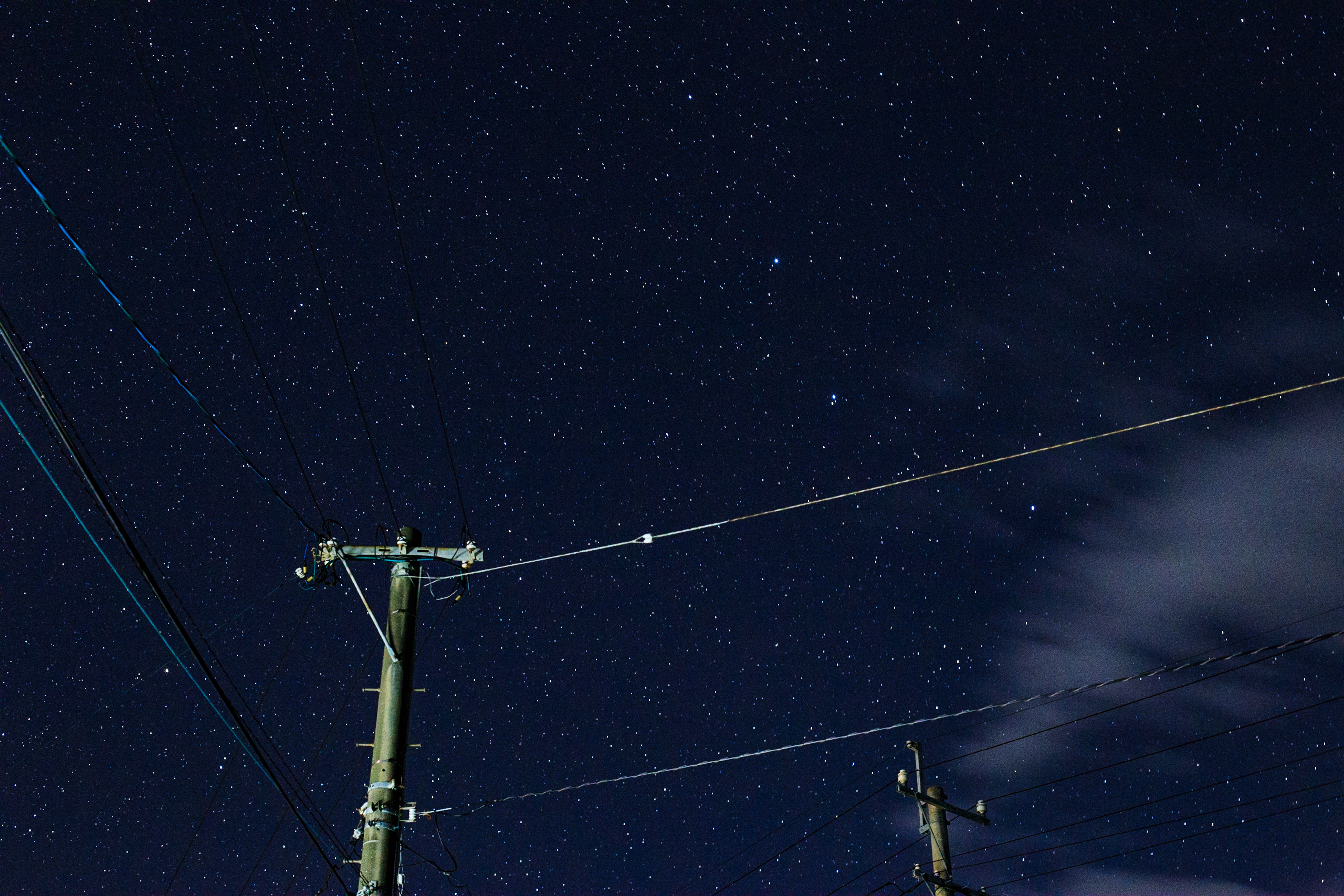 Starry Night Sky with Power Lines and Poles HD Wallpaper