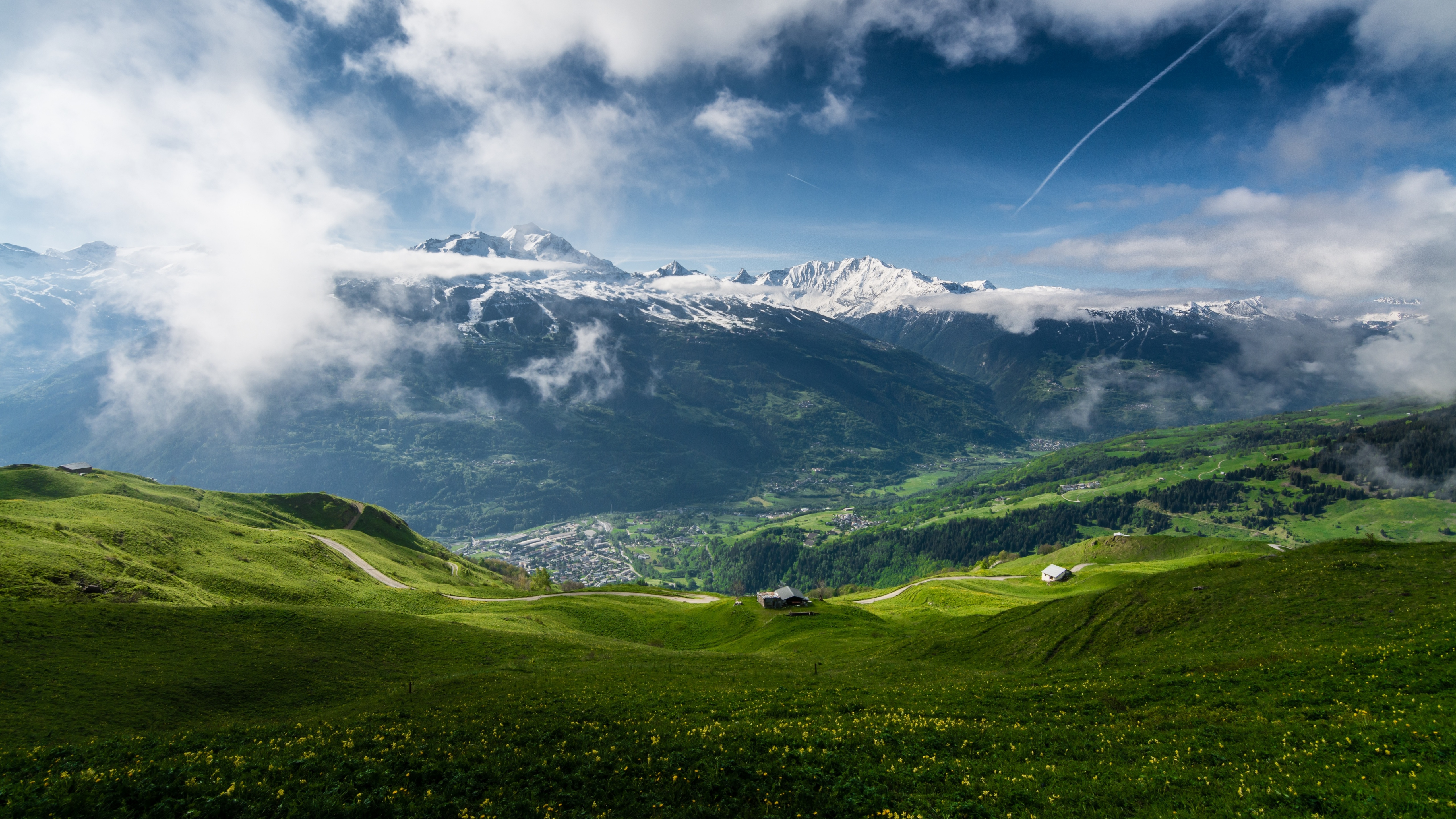 Green mountain valley with snow-capped mountains and clouds HD Wallpaper