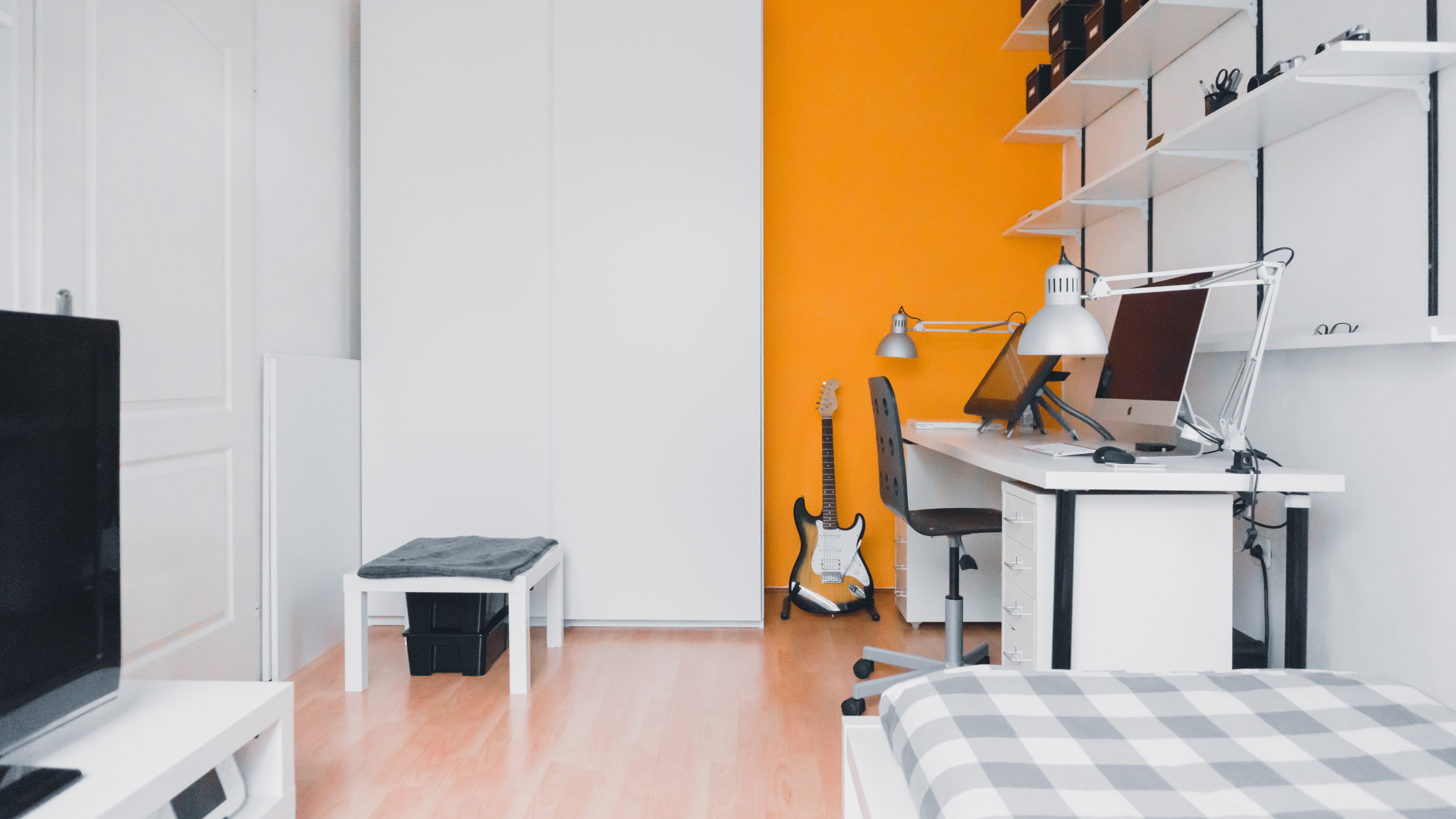 Minimalist workspace with iMac, guitar, and shelves HD Wallpaper
