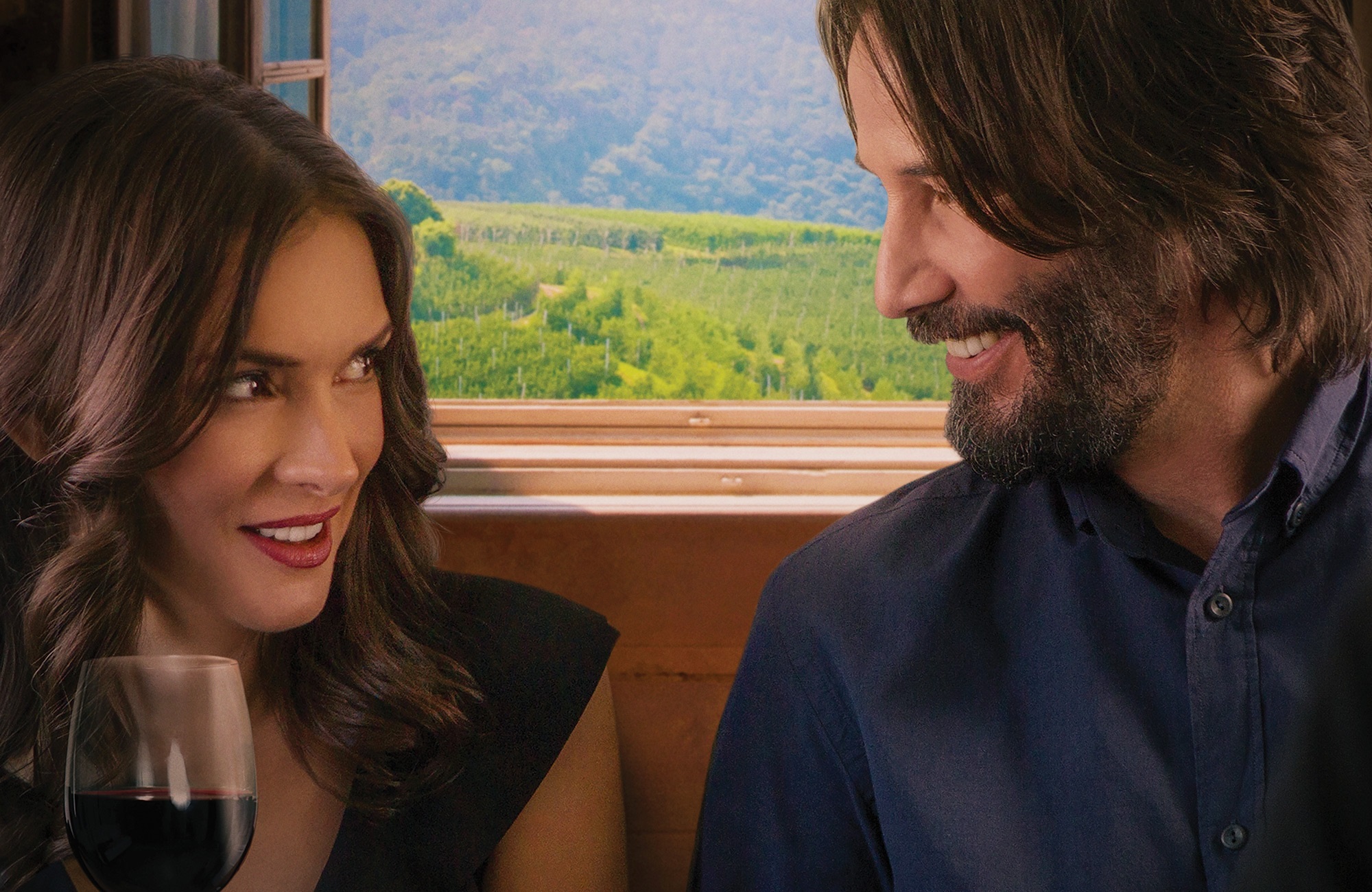 Winona Ryder and Keanu Reeves on a train HD Wallpaper