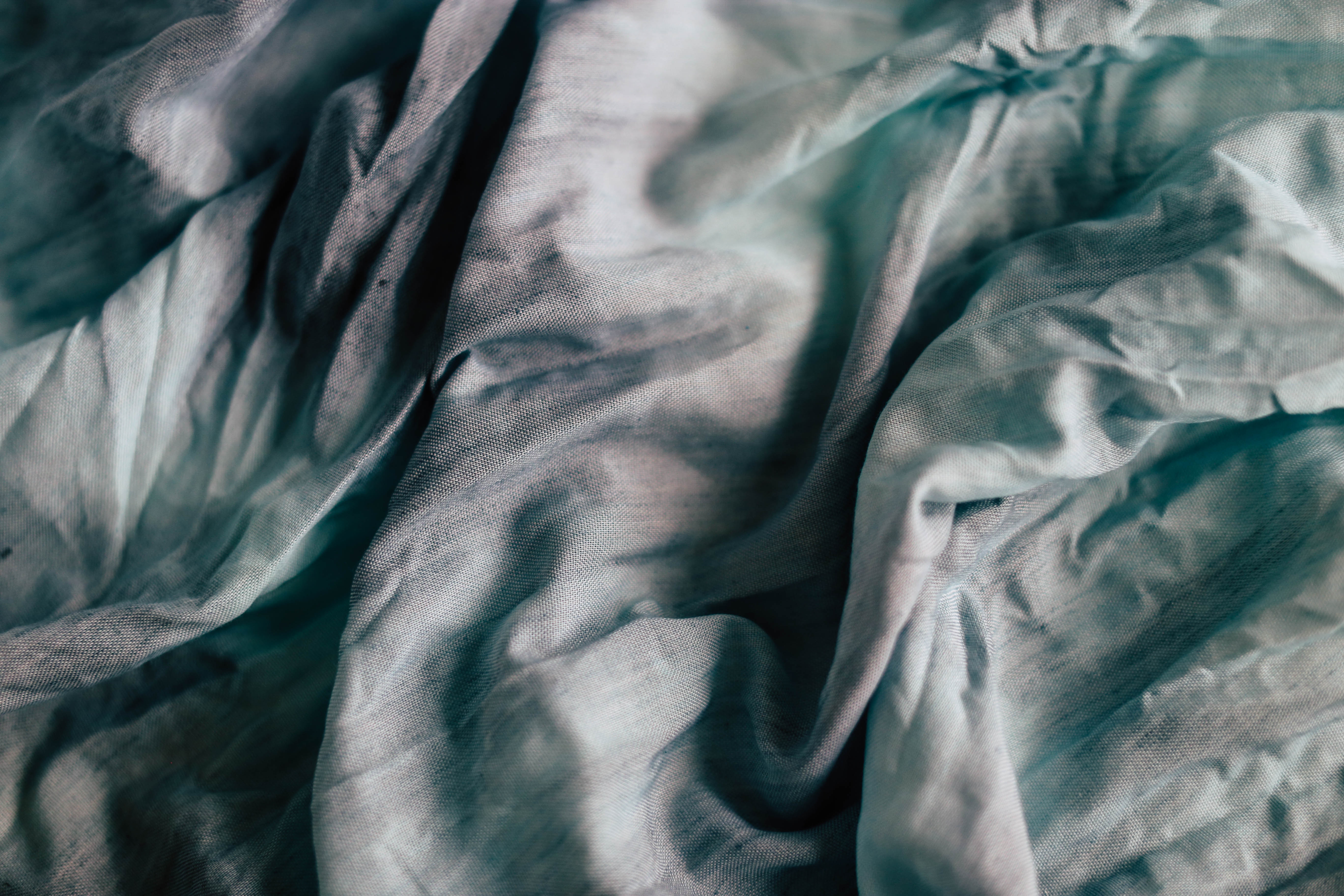 Textured blue and grey creased fabric HD Wallpaper