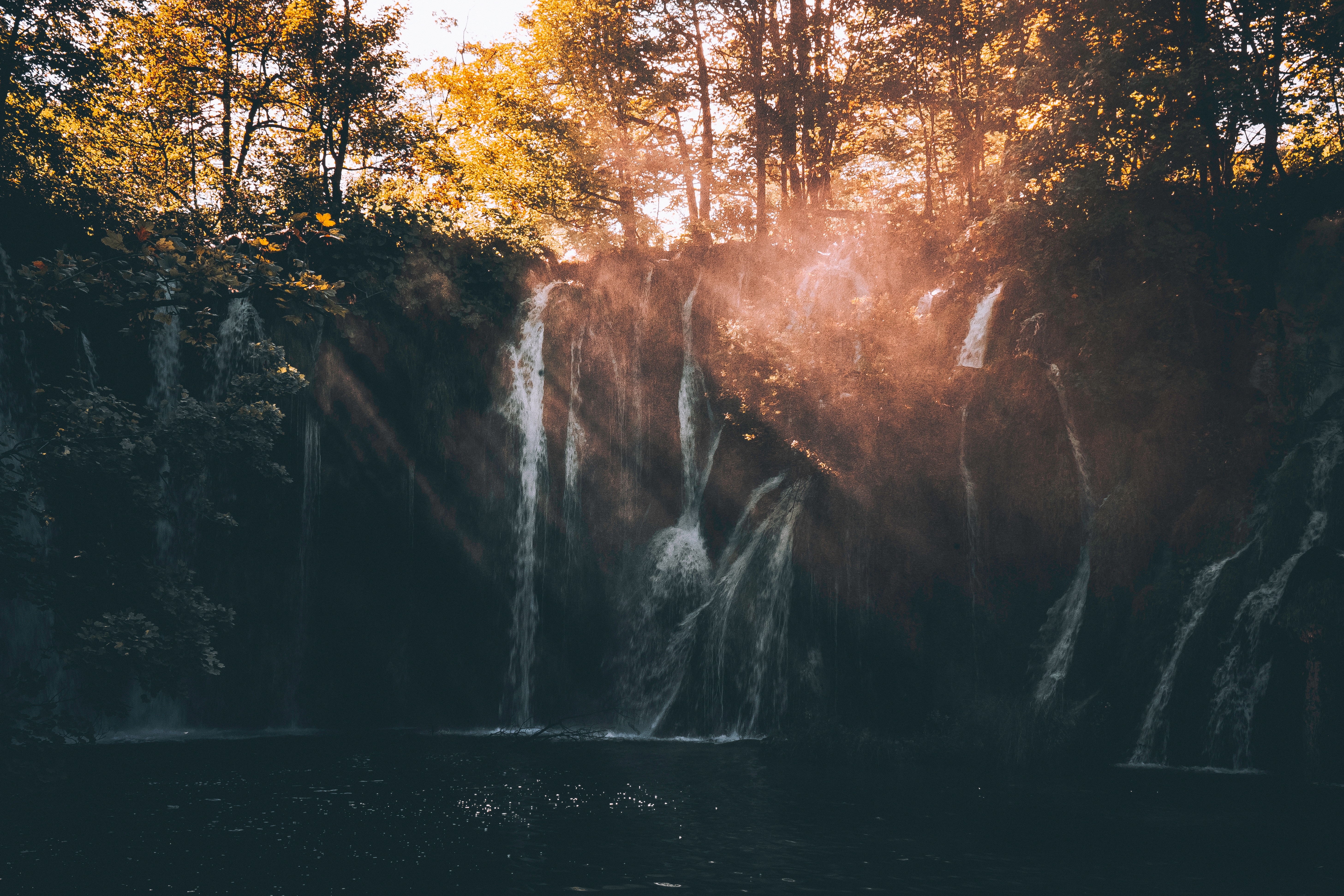 Sunlit Waterfall and Mist in Plitvice Forest HD Wallpaper
