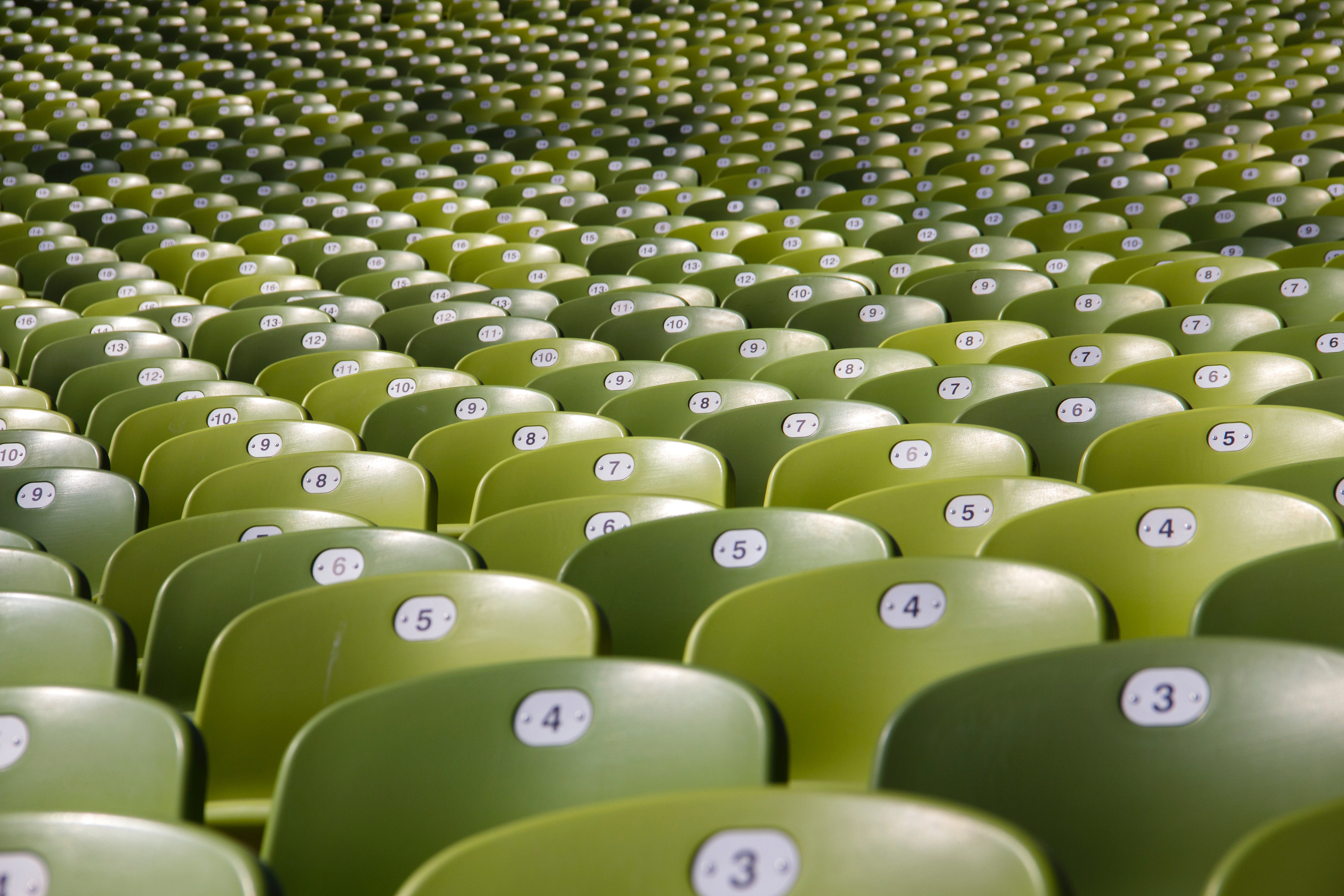 Empty stadium seats in rows HD Wallpaper