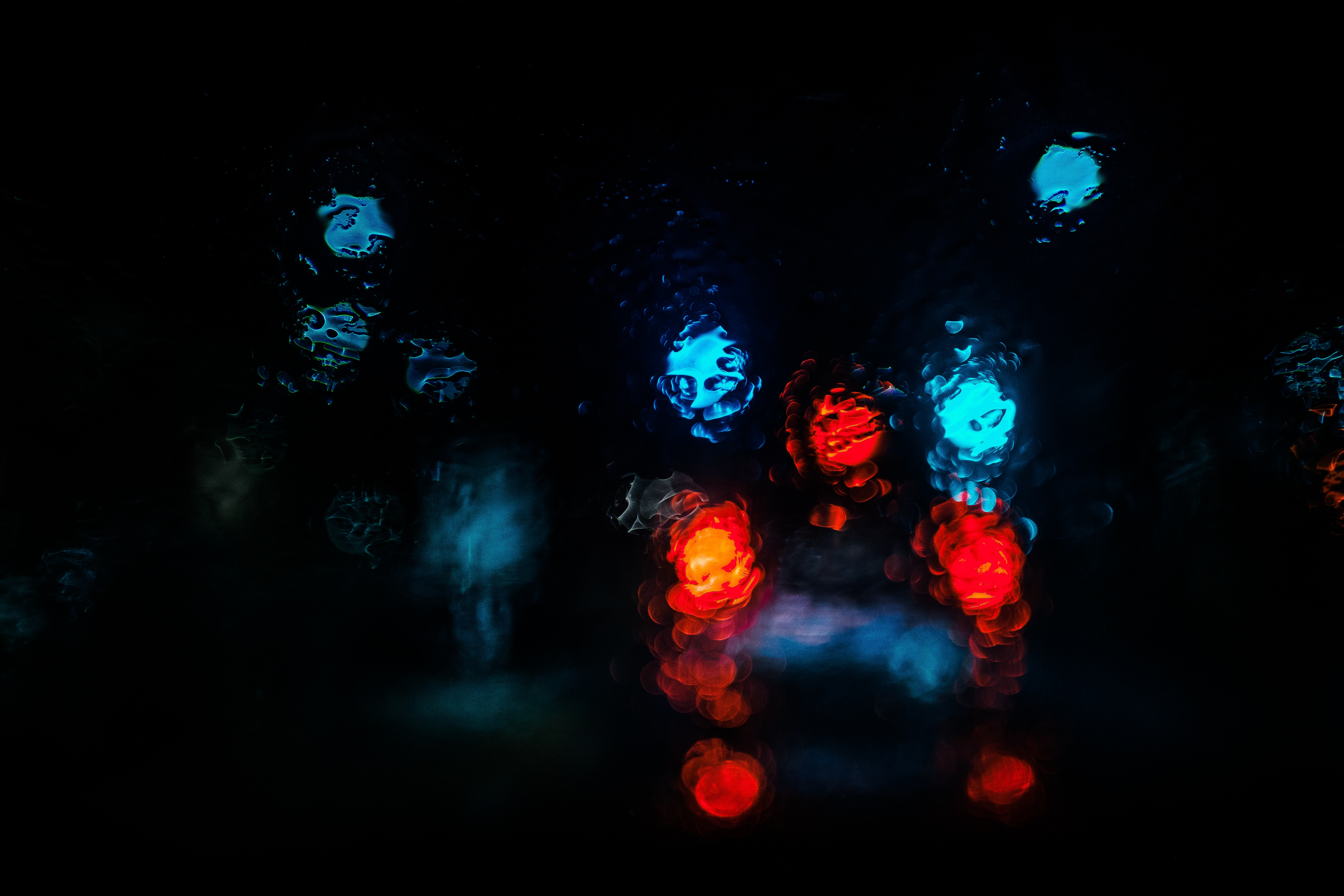 Bokeh of red and blue lights on a rainy night HD Wallpaper