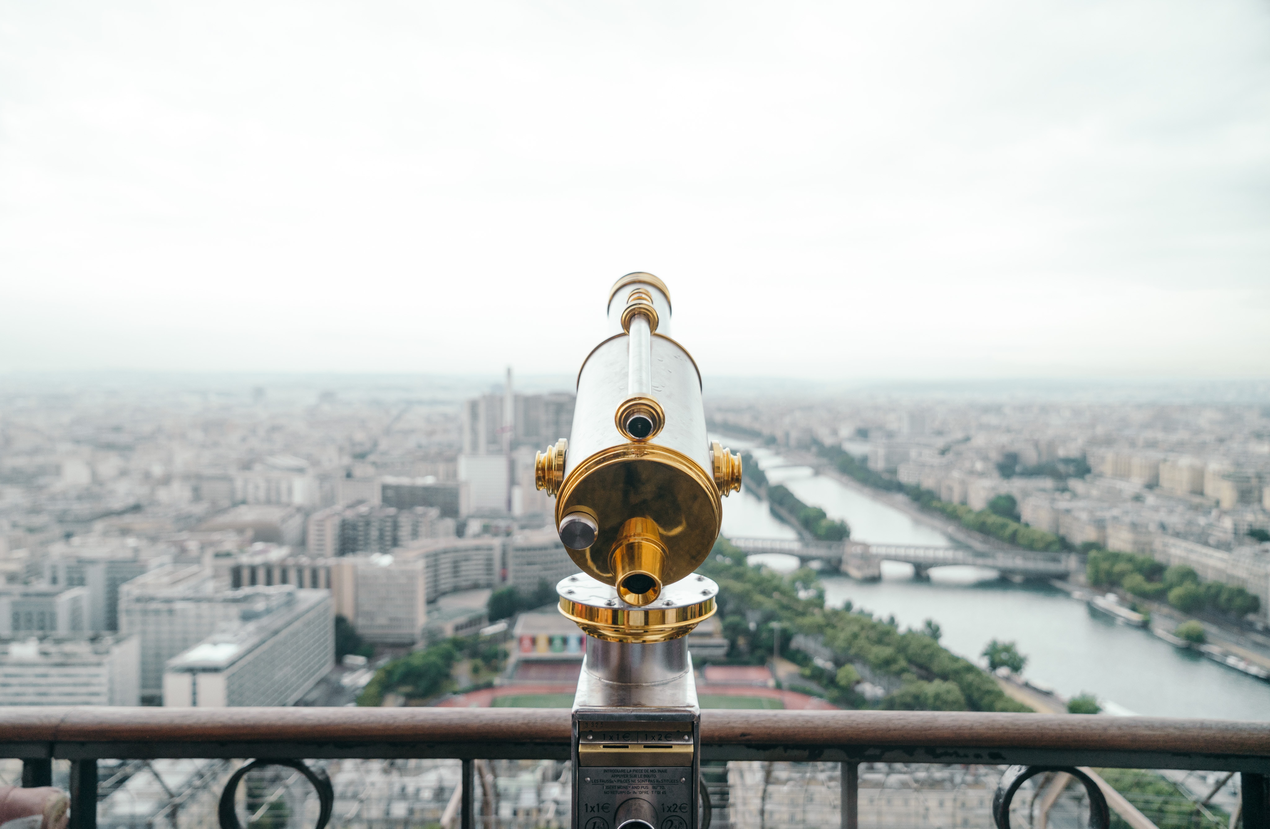 Telescope overlooking Paris cityscape and river HD Wallpaper