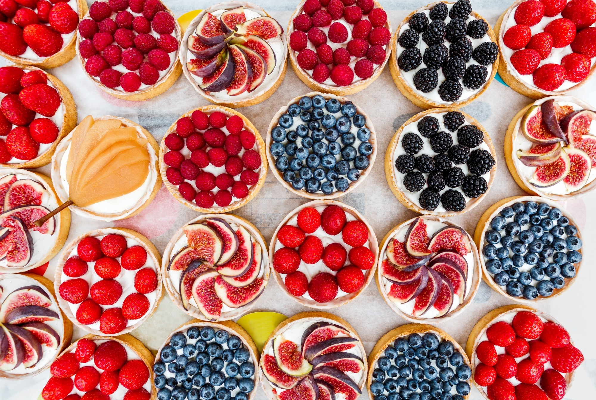 Assortment of Fruit Tarts with Berries and Figs HD Wallpaper