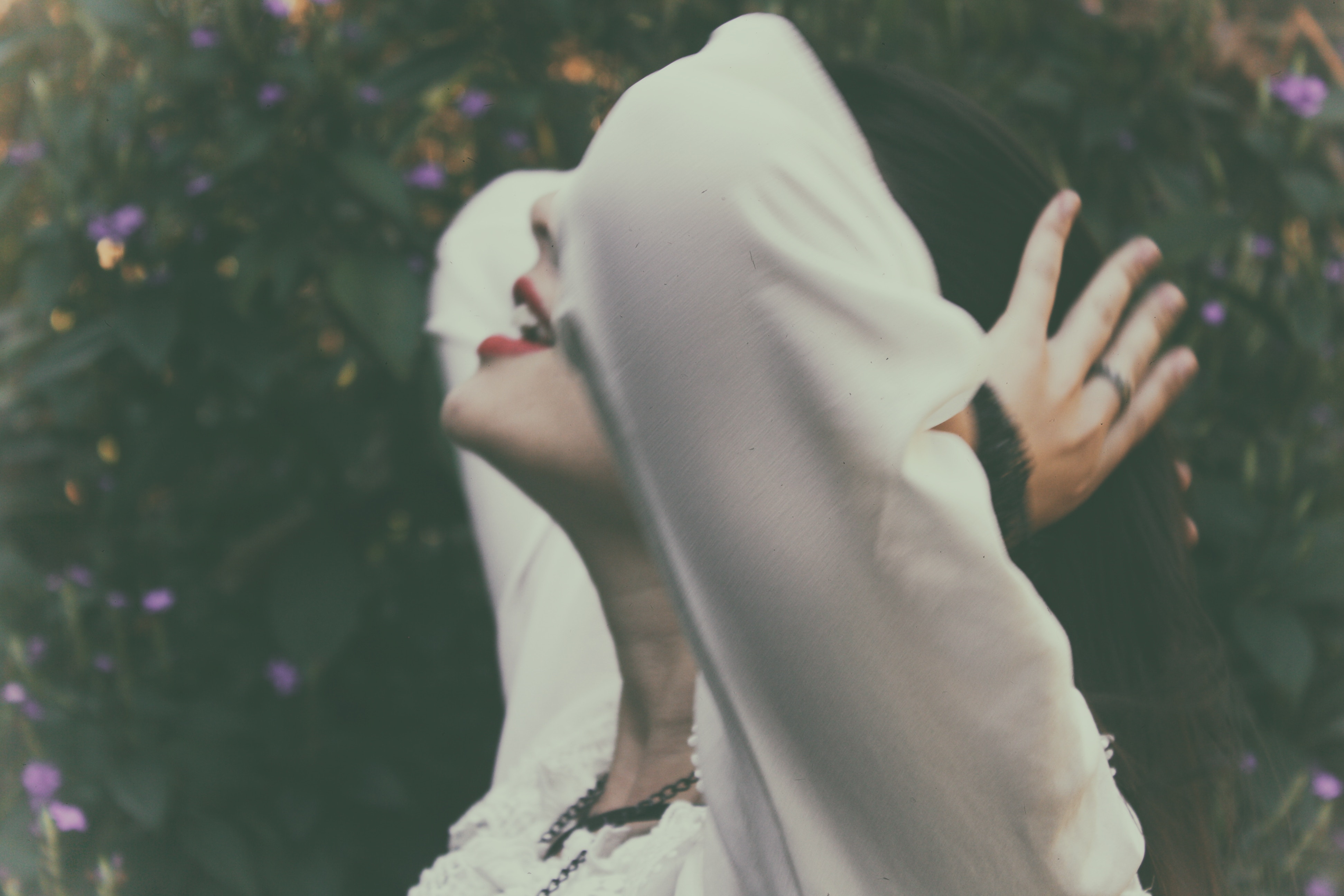 Woman with red lipstick holding her head and hair HD Wallpaper