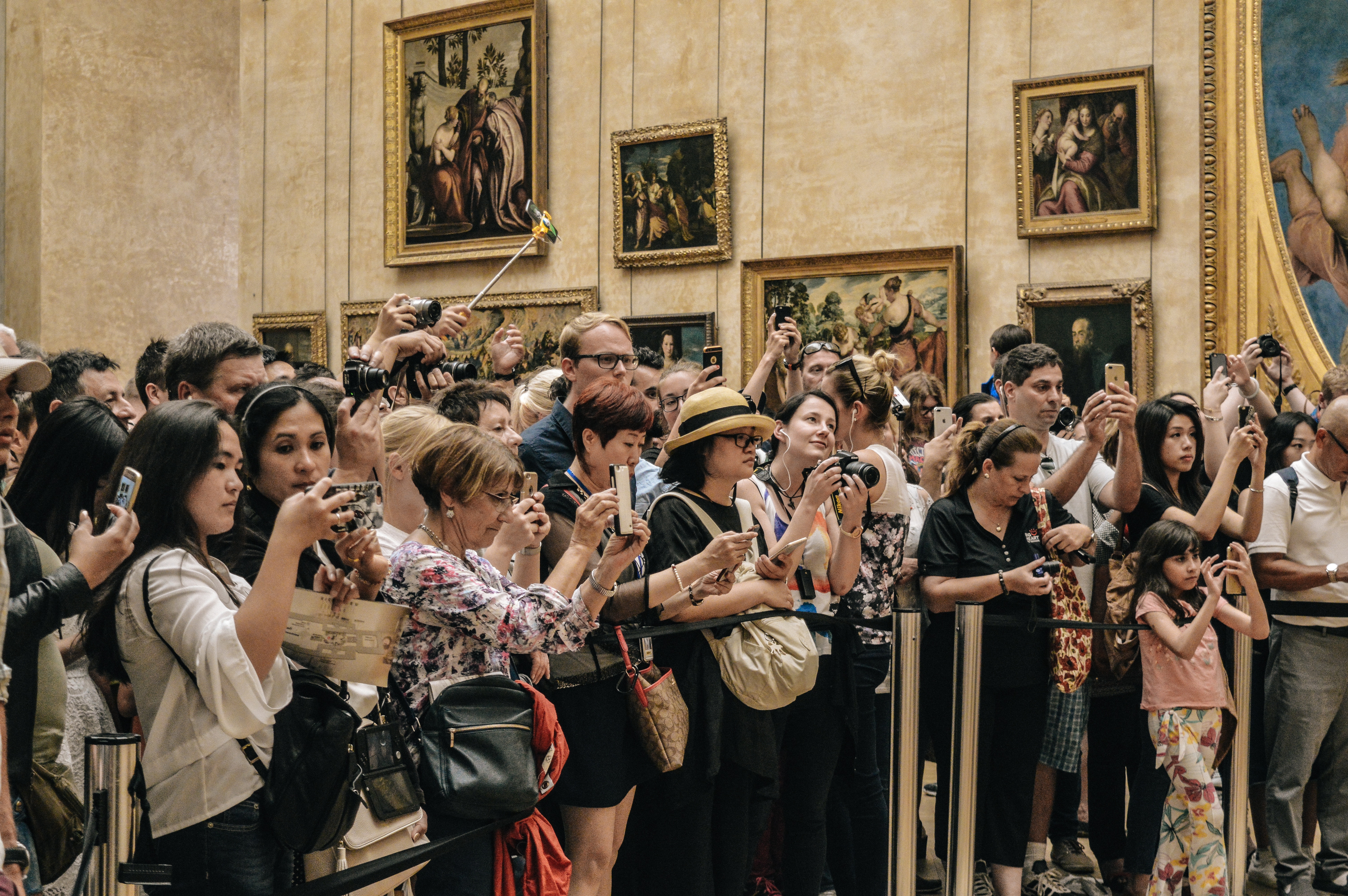 Tourists photograph paintings in a museum HD Wallpaper