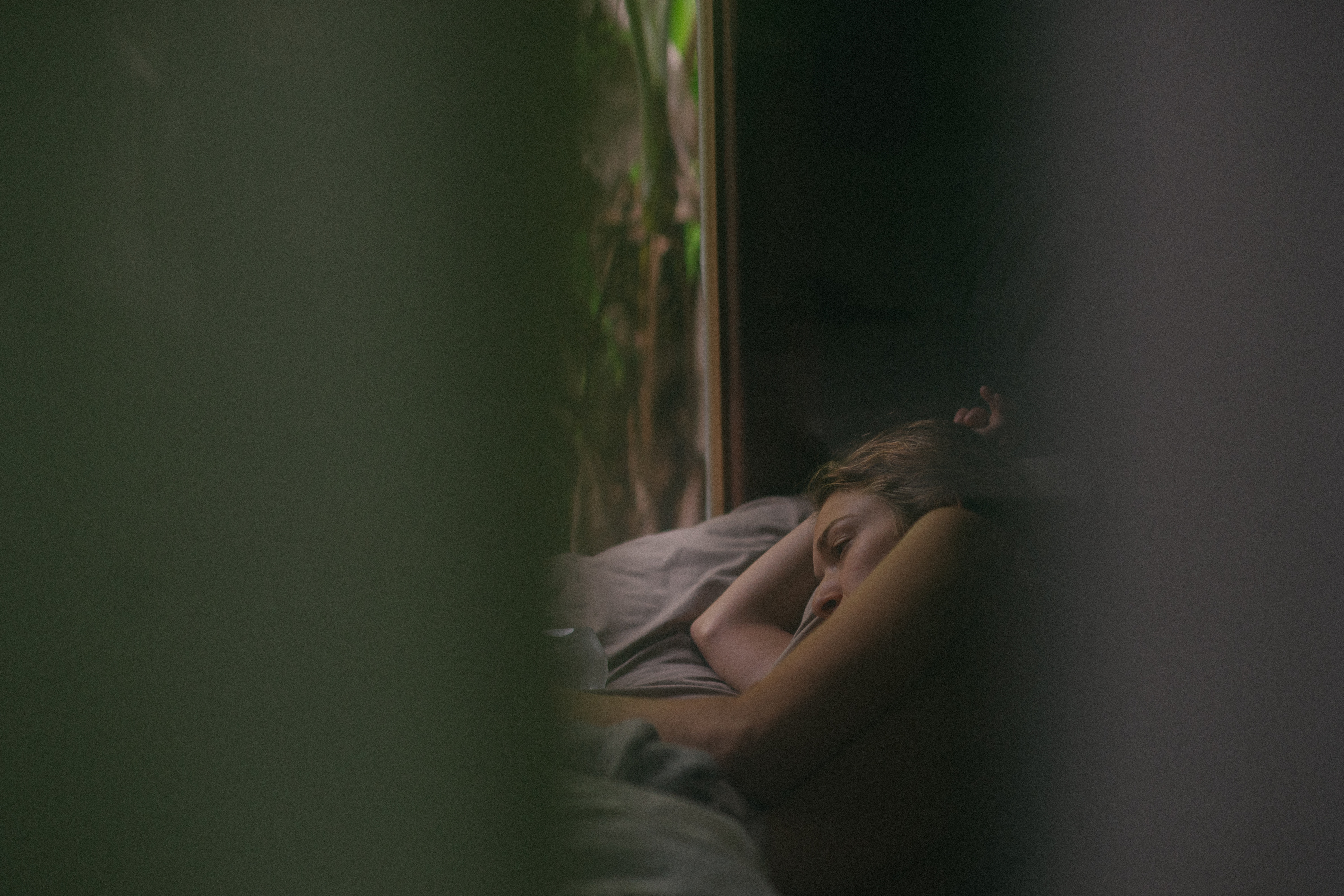 Woman sleeping in bed near a window HD Wallpaper