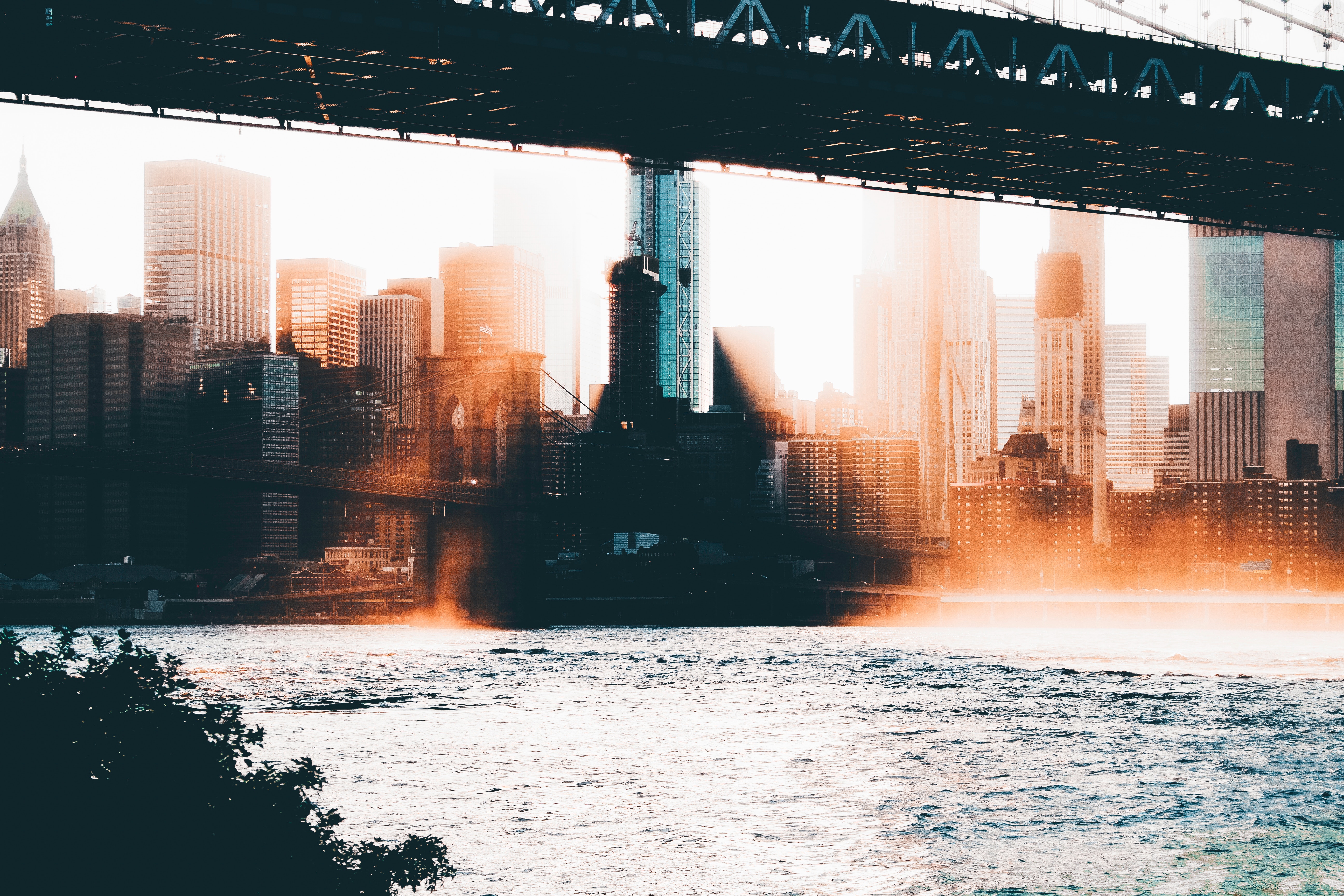 New York City skyline with Brooklyn Bridge and river HD Wallpaper