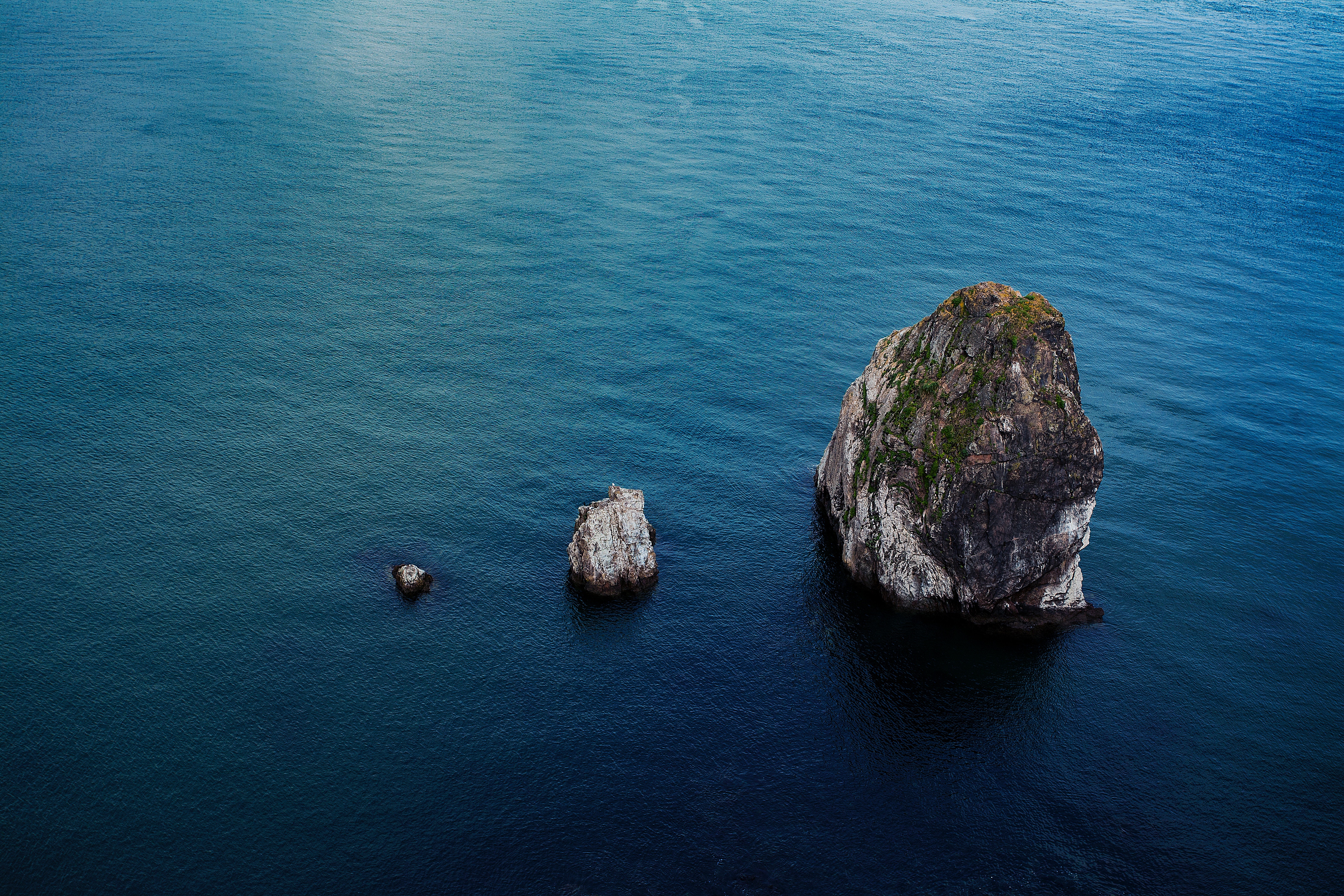 Three rocks in the blue ocean HD Wallpaper