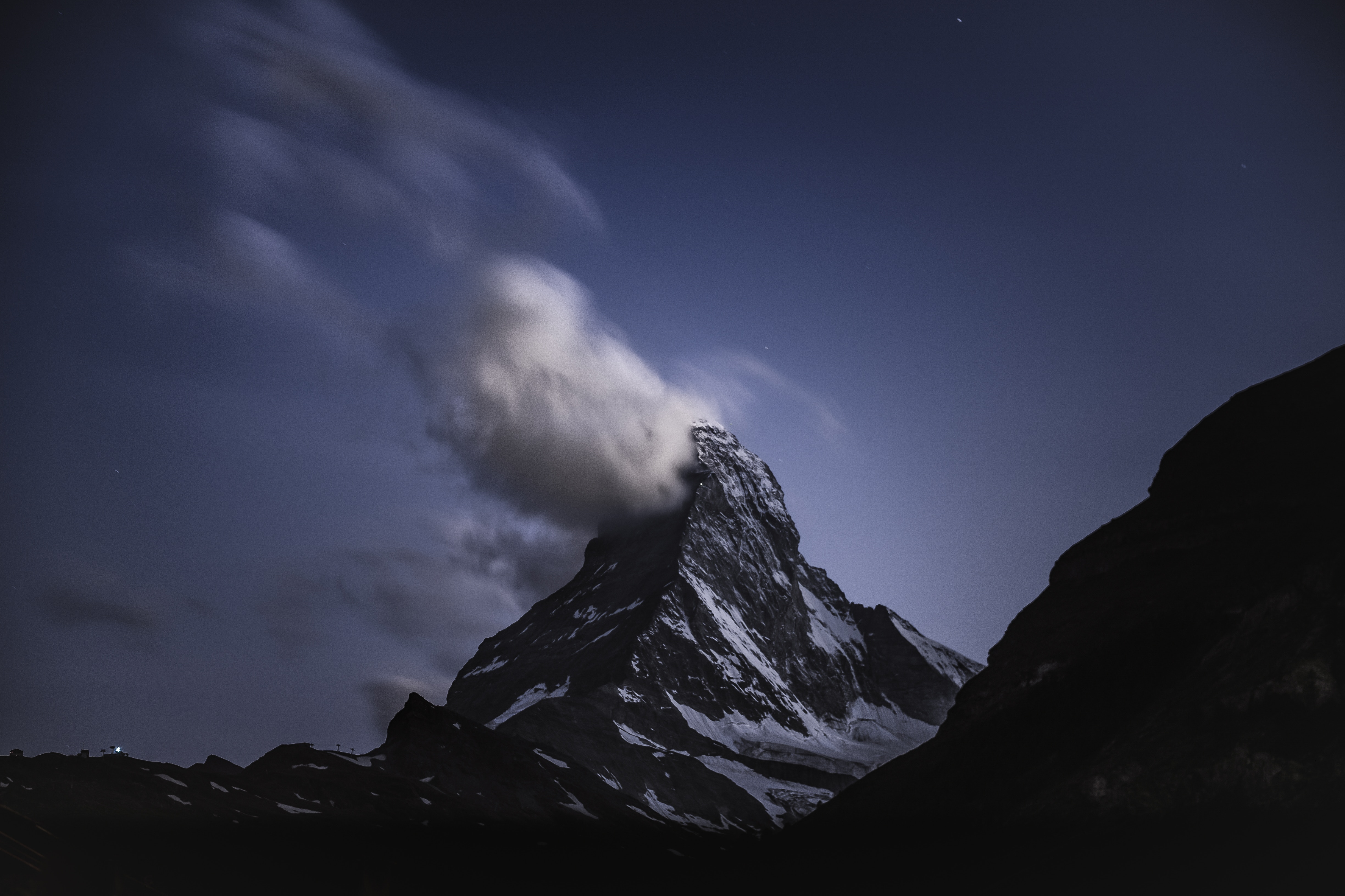 Matterhorn mountain at night with clouds HD Wallpaper