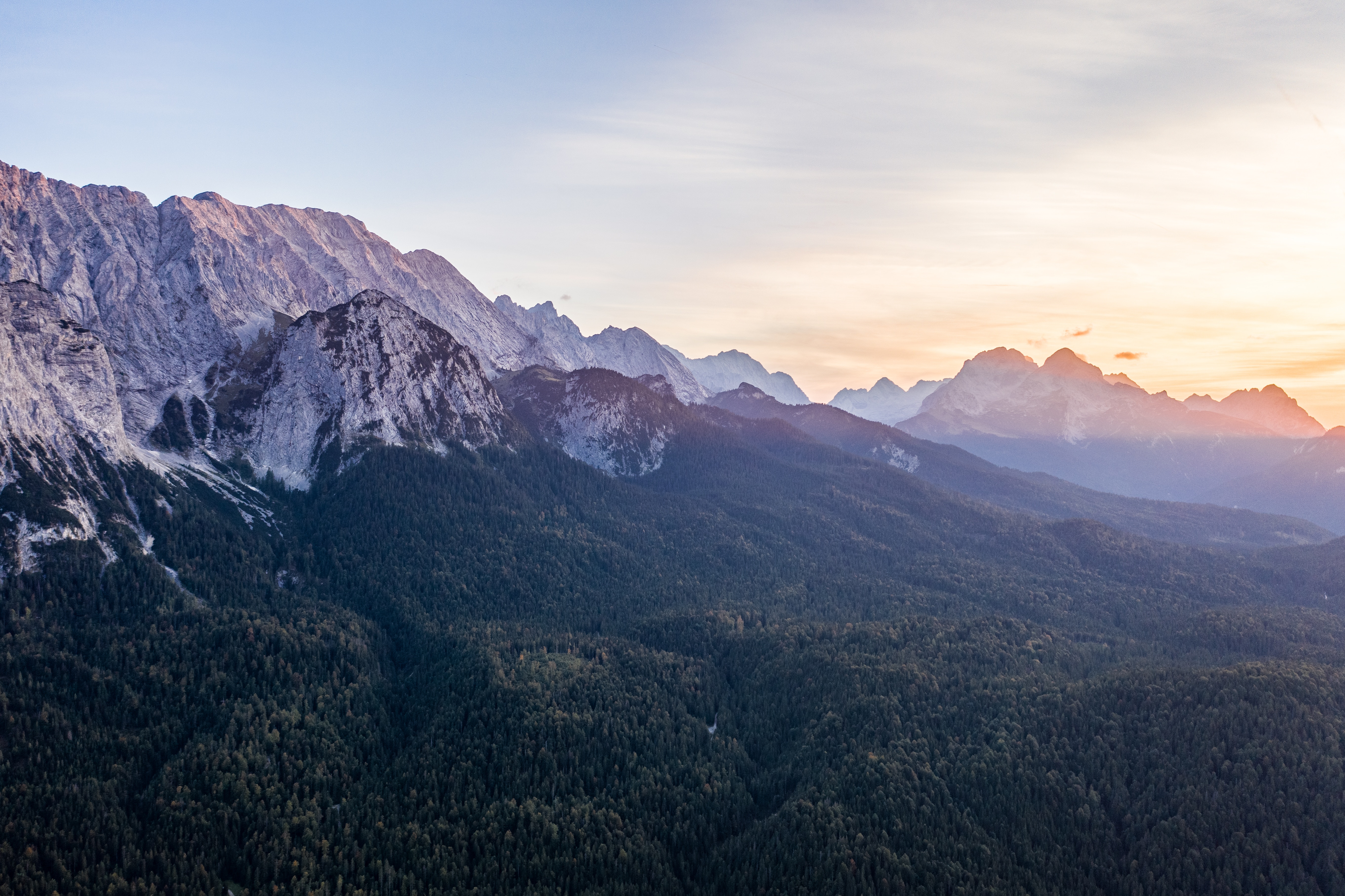 Mountain range with forest at sunset HD Wallpaper