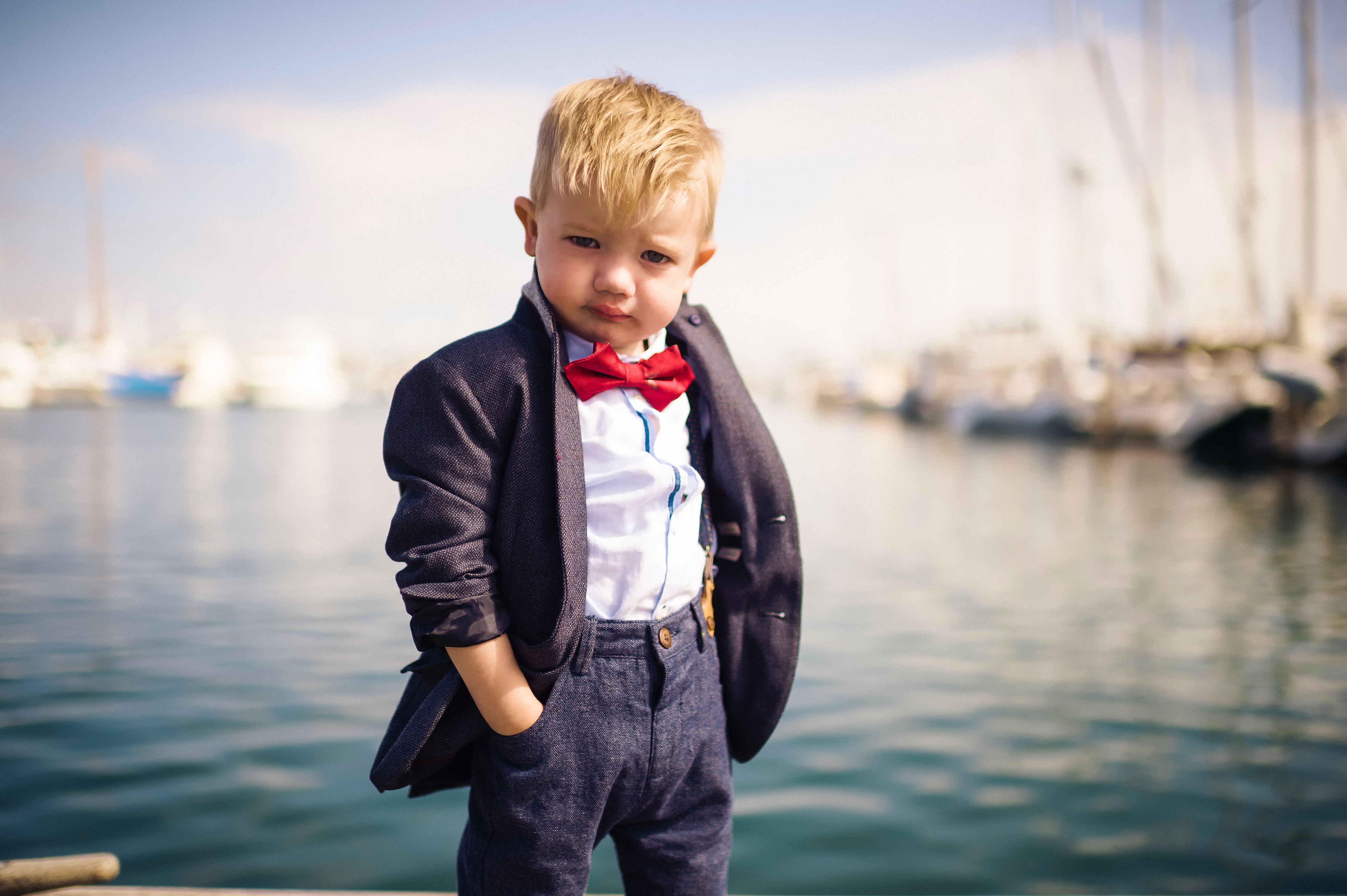 Stylish Young Boy Posing by the Water HD Wallpaper
