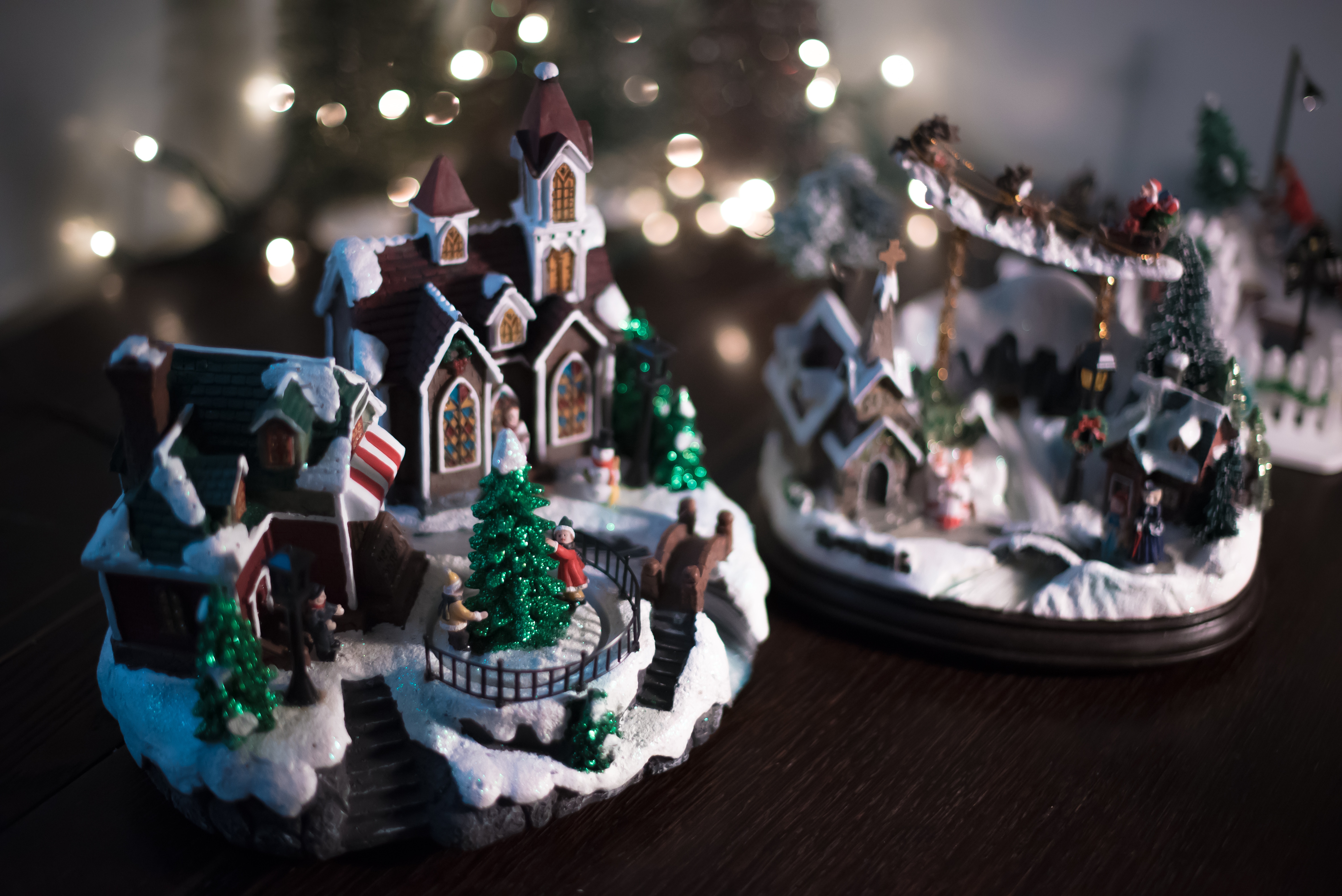 Christmas village scene with lights and snow HD Wallpaper