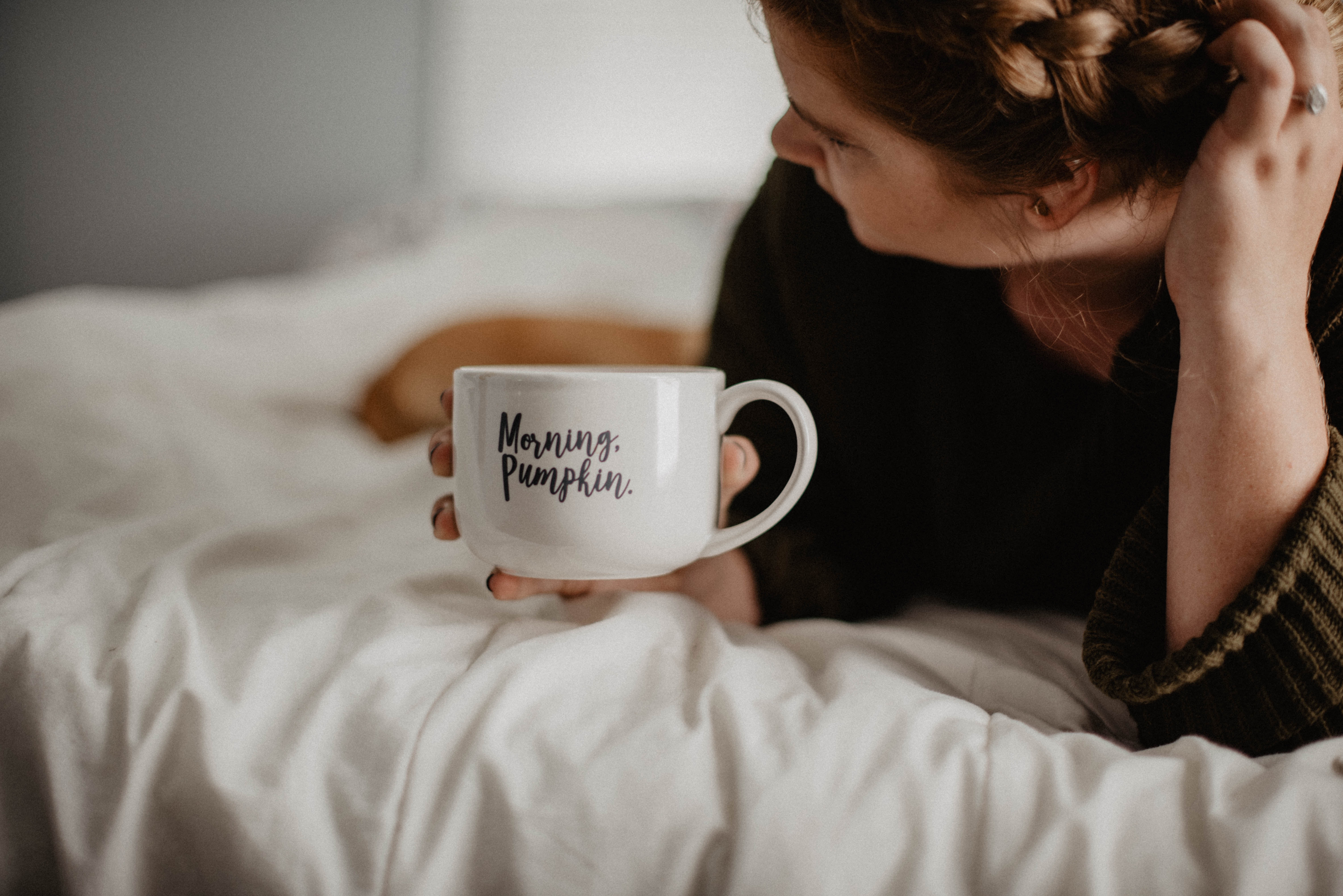 Woman holding a mug that says "Morning, Pumpkin." HD Wallpaper
