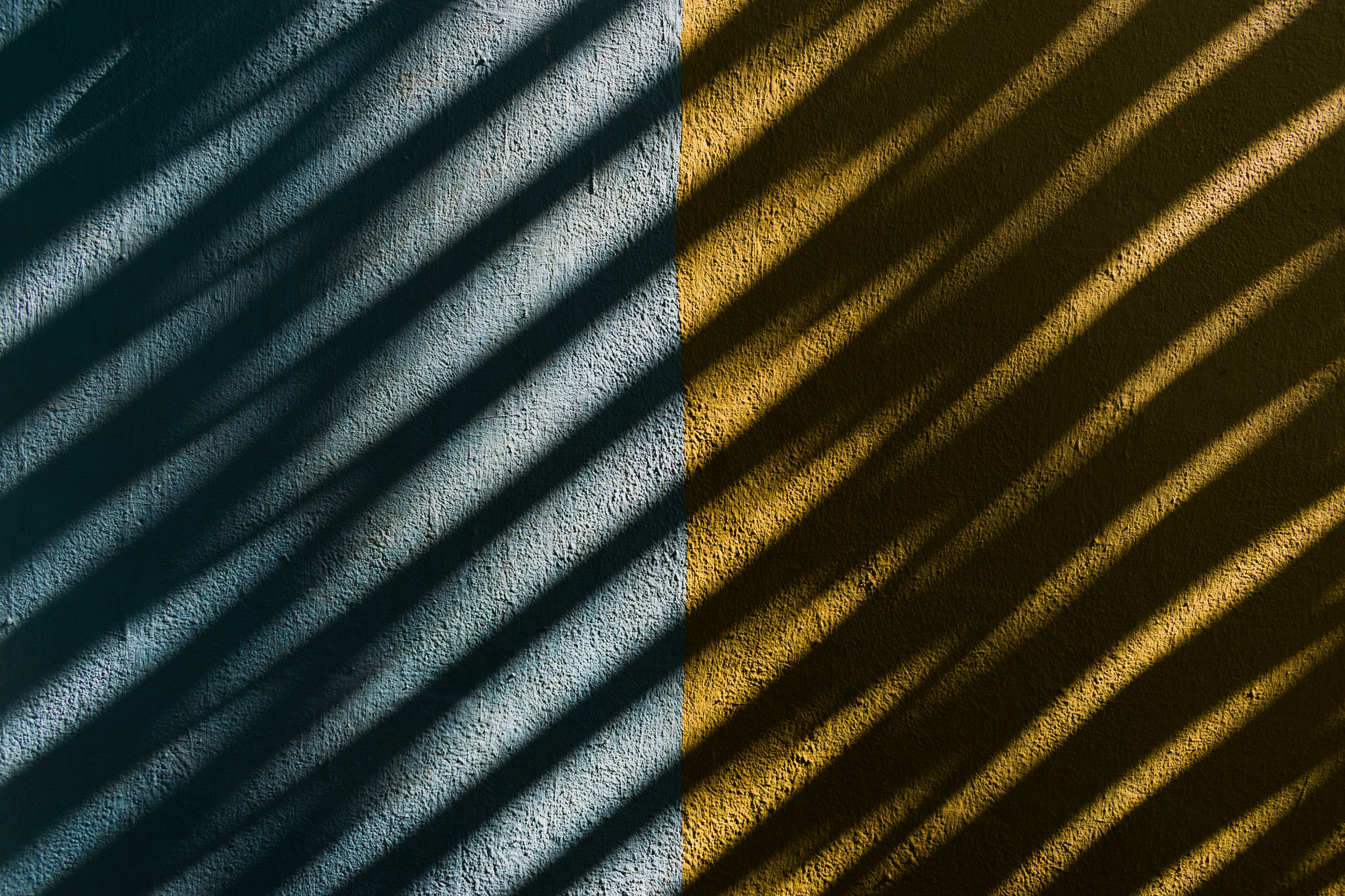 Diagonal shadows on a textured wall HD Wallpaper